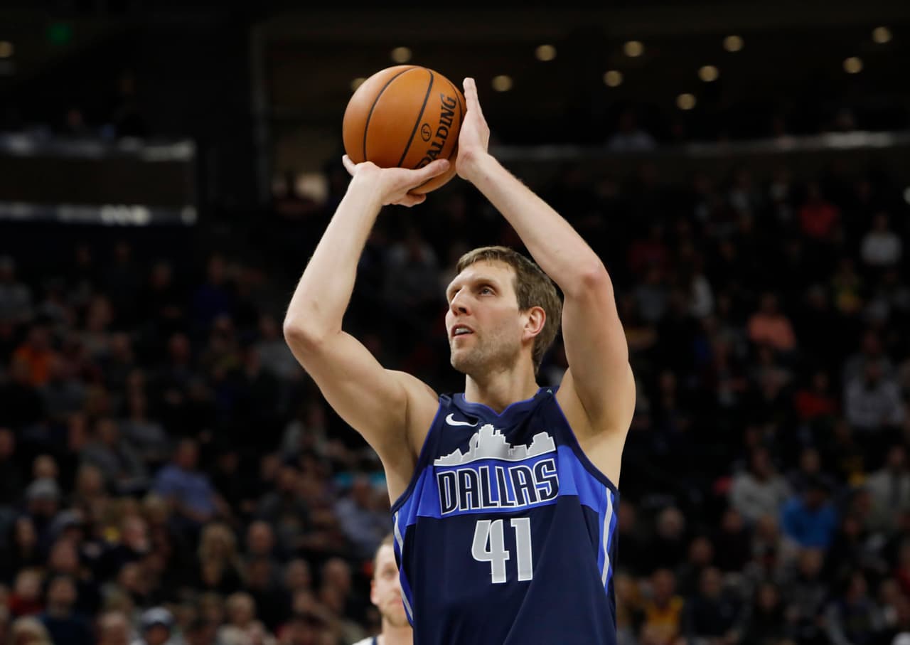 Dallas Mavericks' Dirk Nowitzki shoots a free throw in the first half of an NBA basketball game against the Utah Jazz on Saturday, Feb. 24, 2018, in Salt Lake City. (AP Photo/Kim Raff)