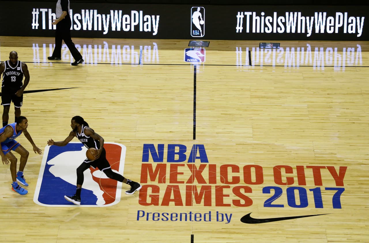 Oklahoma City Thunder's Carmelo Anthony controls the ball during the second half of a regular-season NBA basketball game with Oklahoma City Thunder in Mexico City, Thursday, Dec. 7, 2017. The Brooklyn Nets will also take on the Miami Heat Saturday in their second regular-season game in the Mexican capital. (AP Photo/Rebecca Blackwell)