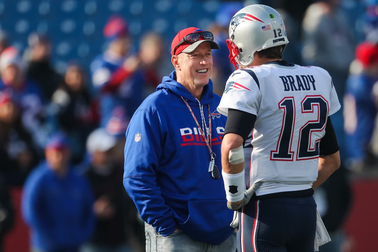 ORCHARD PARK, NY - DECEMBER 3: Jim Kelly talks with Tom Brady #12 of the New England Patriots before a game against the Buffalo Bills December 3, 2017 at New Era Field in Orchard Park, New York. (Photo by Tom Szczerbowski/Getty Images)