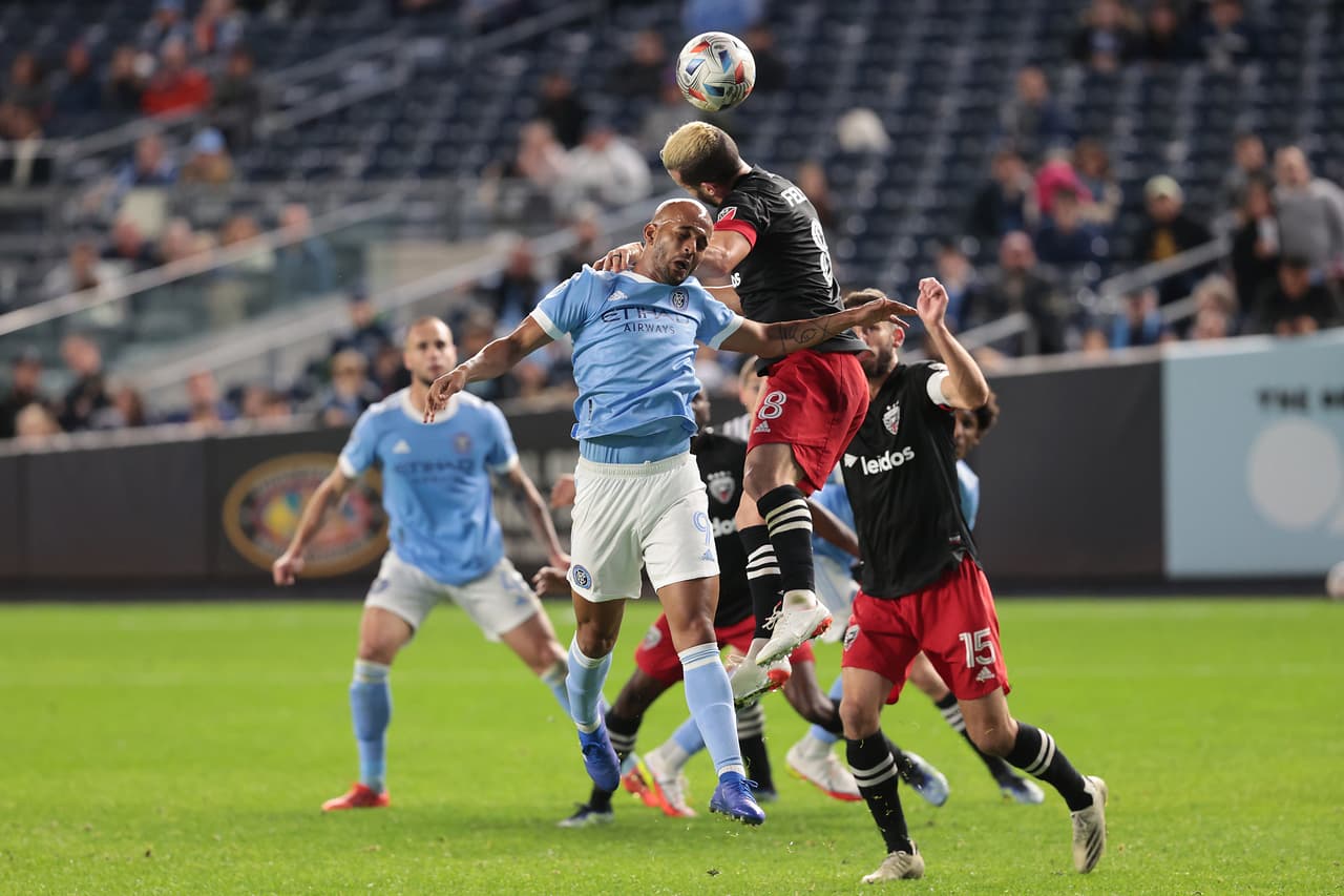 Oct 23, 2021; New York, New York, USA; New York City FC forward Heber (9) battles for a high ball against D.C. United midfielder Felipe Martins (8) during the second half at Yankee Stadium. Mandatory Credit: Vincent Carchietta-USA TODAY Sports