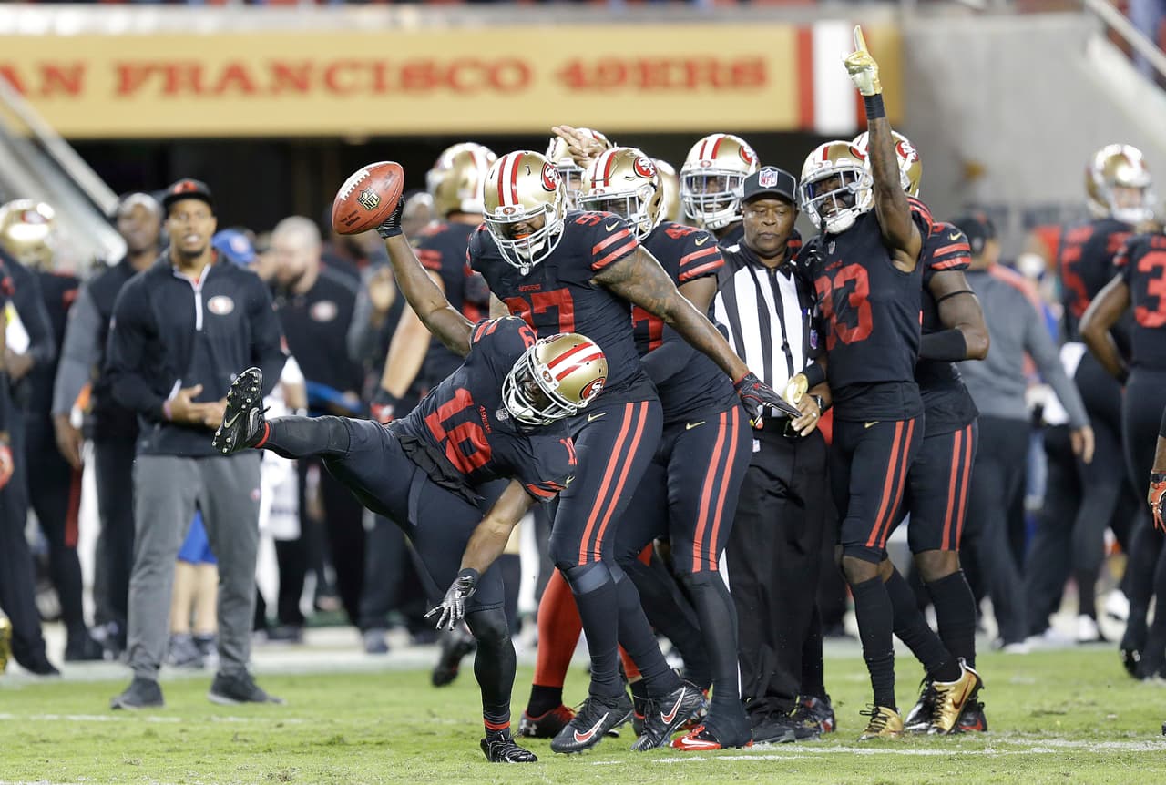 San Francisco 49ers' Aldrick Robinson, left, celebrates after recovering a fumble during the second half of an NFL football game against the Los Angeles Rams in Santa Clara, Calif., Thursday, Sept. 21, 2017. (AP Photo/Ben Margot)