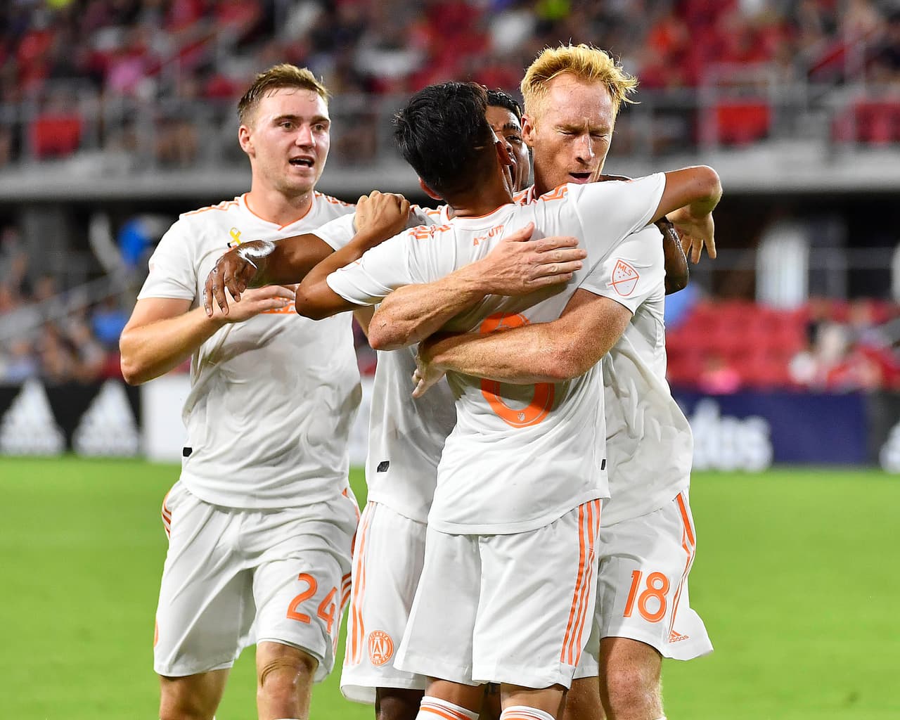 Sep 2, 2018; Washington, DC, USA; Atlanta United defender Jeff Larentowicz (18) is congratulated by teammates after scoring a goal against the D.C. United during the first half at Audi Field. Mandatory Credit: Brad Mills-USA TODAY Sports