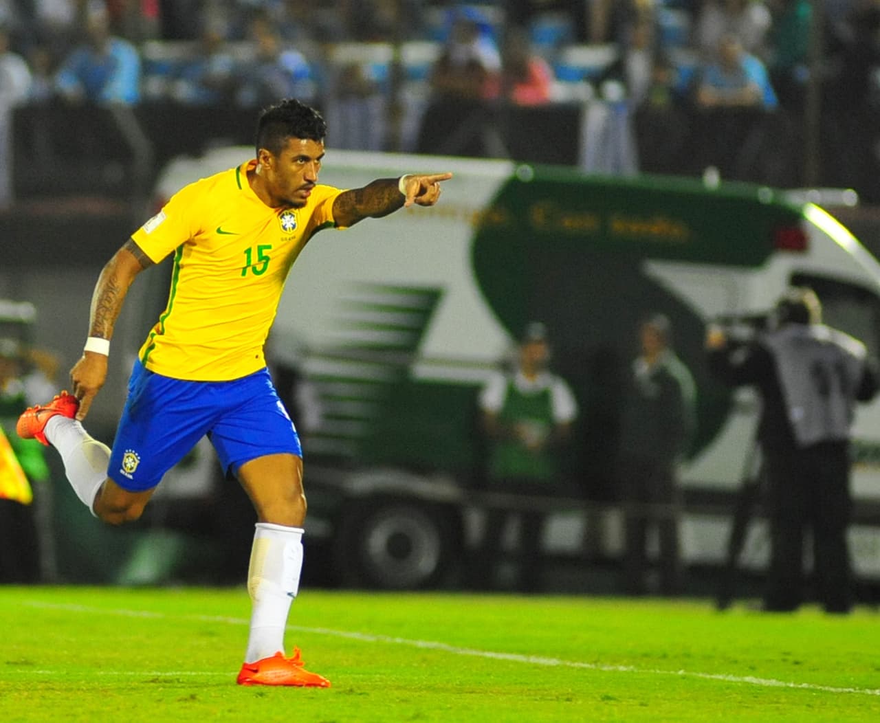 Brazil's midfieler Paulinho celebrates after scoring against Uruguay during their 2018 FIFA World Cup qualifier football match at the Centenario stadium in Montevideo, on March 23, 2017. / AFP PHOTO / DANTE FERNANDEZ (Photo credit should read DANTE FERNANDEZ/AFP/Getty Images)