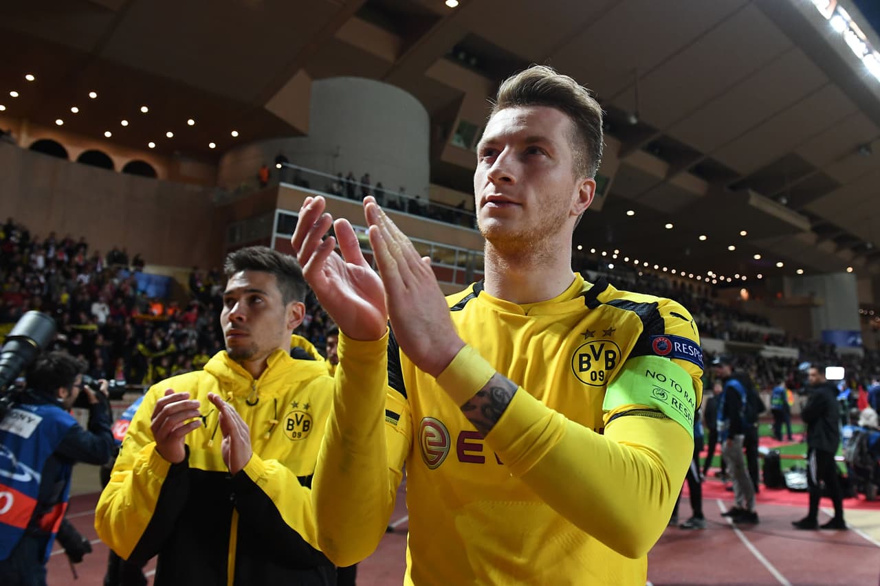 Dortmund's forward Marco Reus (R) acknowledges fans after Monaco defeated Dortmund during the UEFA Champions League 2nd leg quarter-final football match AS Monaco v BVB Borussia Dortmund on April 19, 2017 at the Louis II stadium in Monaco. / AFP PHOTO / BORIS HORVAT (Photo credit should read BORIS HORVAT/AFP/Getty Images)