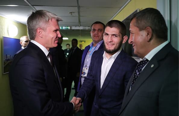 ULYANOVSK, RUSSIA OCTOBER 10, 2018: Russia's Sport Minister Pavel Kolobkov, MMA fighter and UFC lightweight champion Khabib Nurmagomedov, and his father and coach Abdulmanap Nurmagomedov (L-R front) attend the 7th Russia A Sports Power international forum, at Volga-Sport-Arena. Mikhail Klimentyev/Russian Presidential Press and Information Office/TASS (Photo by Mikhail Klimentyev\TASS via Getty Images)