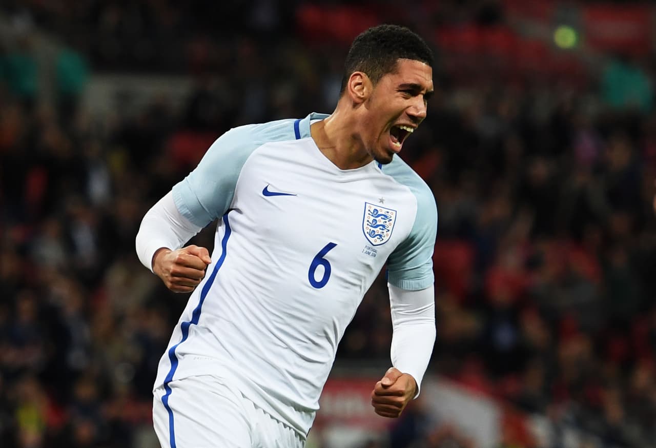 LONDON, ENGLAND - JUNE 02: Chris Smalling of England celebrates as he scores their first goal during the international friendly match between England and Portugal at Wembley Stadium on June 2, 2016 in London, England. (Photo by Shaun Botterill/Getty Images)