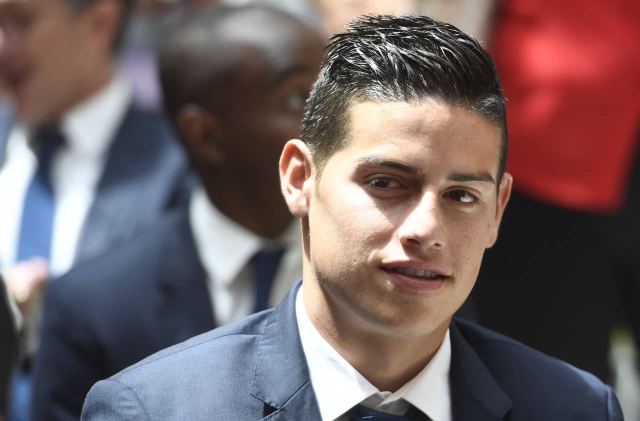 Real Madrid's Colombian midfielder James Rodriguez smiles at the Madrid Community headquarters, in Madrid on May 22, 2017 during a celeration after the team won the Spanish league football tournament. Madrid sealed a first La Liga title in five years yesterday -- and 33rd in total -- with a 2-0 victory at Malaga to bring a halt to Barcelona's domination of domestic matters having won six of the previous eight titles. / AFP PHOTO / CURTO DE LA TORRE (Photo credit should read CURTO DE LA TORRE/AFP/Getty Images)