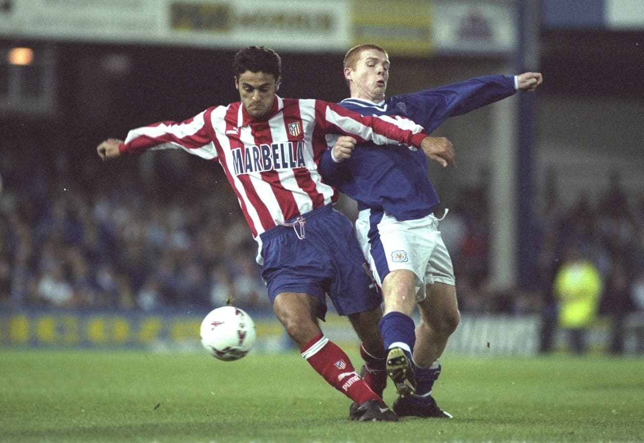 30 Sep 1997: Neil Lennon of Leicester City (right) is jostled off the ball by an Atletico Madrid player during the UEFA Cup match at Filbert Street in Leicester, England. Atletico Madrid won the match 0-2. \ Mandatory Credit: Graham Chadwick /Allsport