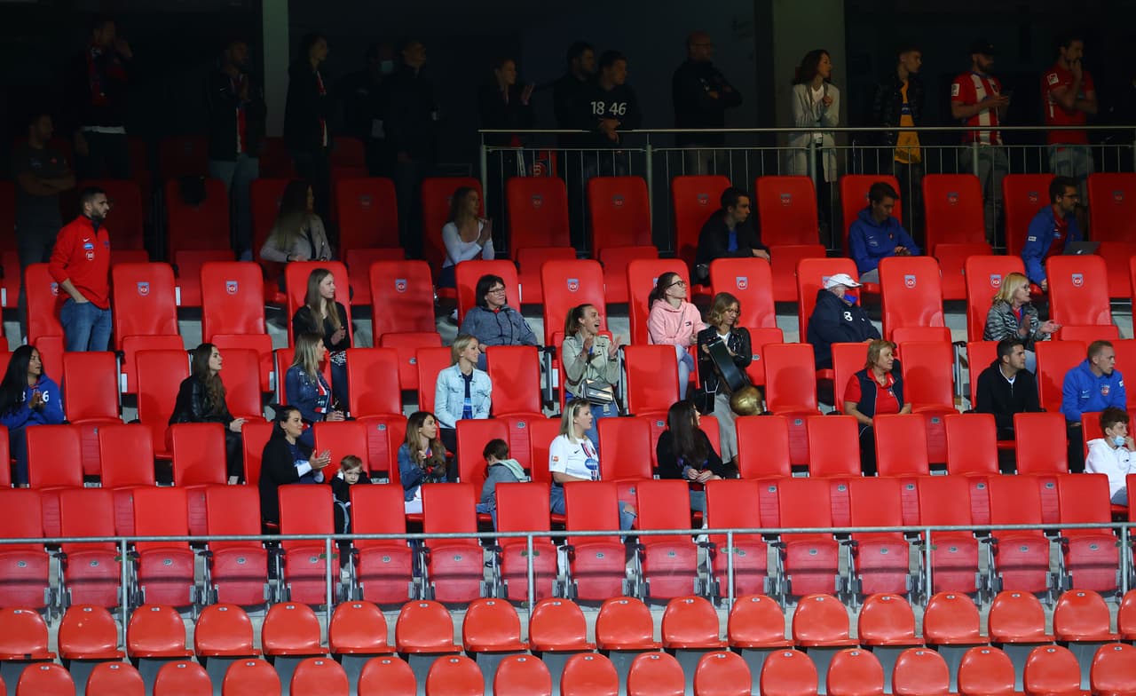 People keep distance as they watch the relegation second leg play-off football match between German second division Bundesliga club FC Heidenheim and First divison Bundesliga club Werder Bremen in Heidenheim, on July 6, 2020. (Photo by KAI PFAFFENBACH / POOL / AFP) / DFL REGULATIONS PROHIBIT ANY USE OF PHOTOGRAPHS AS IMAGE SEQUENCES AND/OR QUASI-VIDEO (Photo by KAI PFAFFENBACH/POOL/AFP via Getty Images)