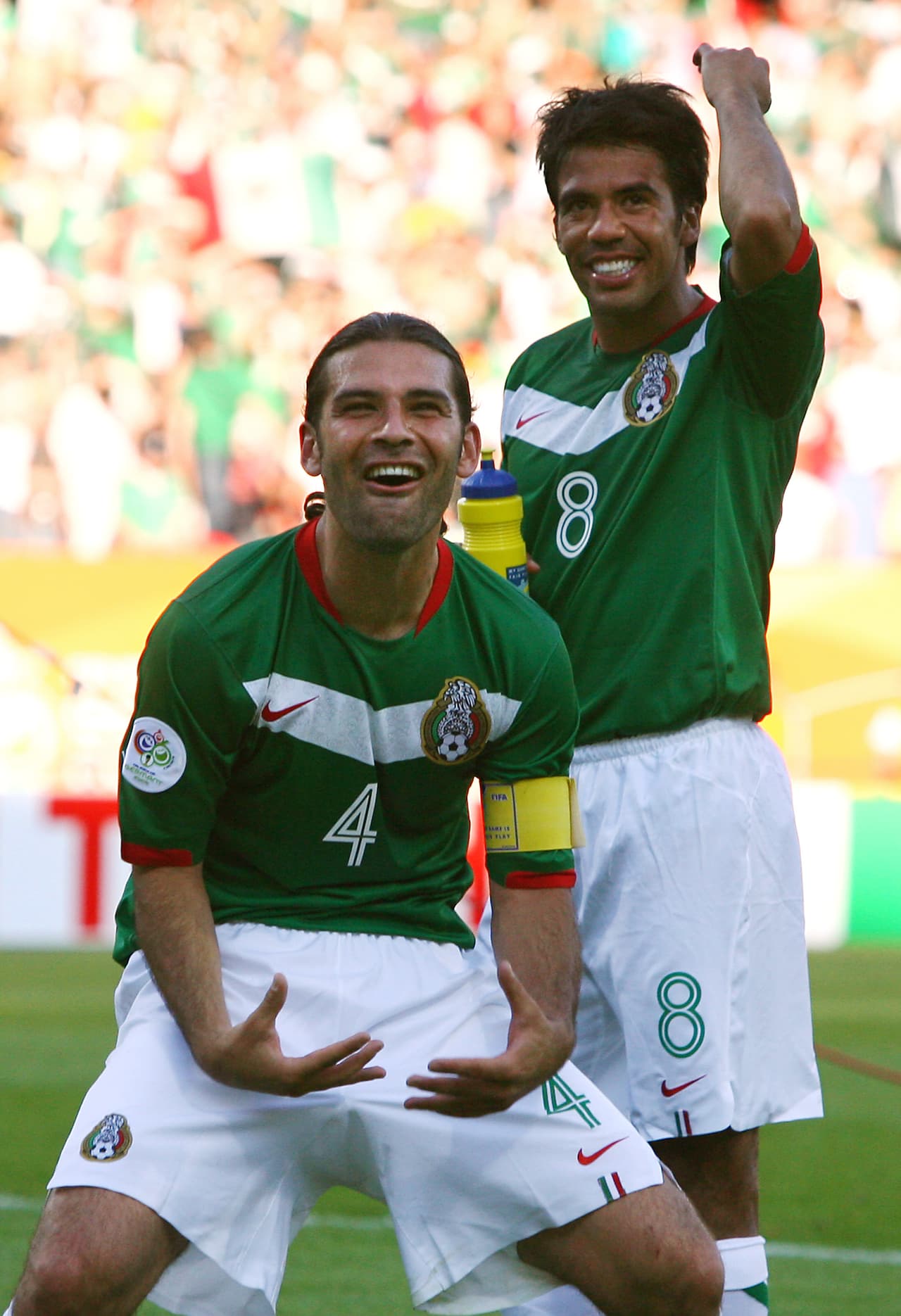 Mexican defender and captain Rafael Marquez (L) and teammate Mexican midfielder Pavel Pardo celebrates their victory over Iran in their first round Group D World Cup football match at Nuremberg's Franken Stadium, 11 June 2006. Mexico scored twice in three second-half minutes to beat Iran 3-1, and give a massive boost to their bid to go past the World Cup quarter-finals for the first time. AFP PHOTO / OMAR TORRES (Photo credit should read OMAR TORRES/AFP/Getty Images)