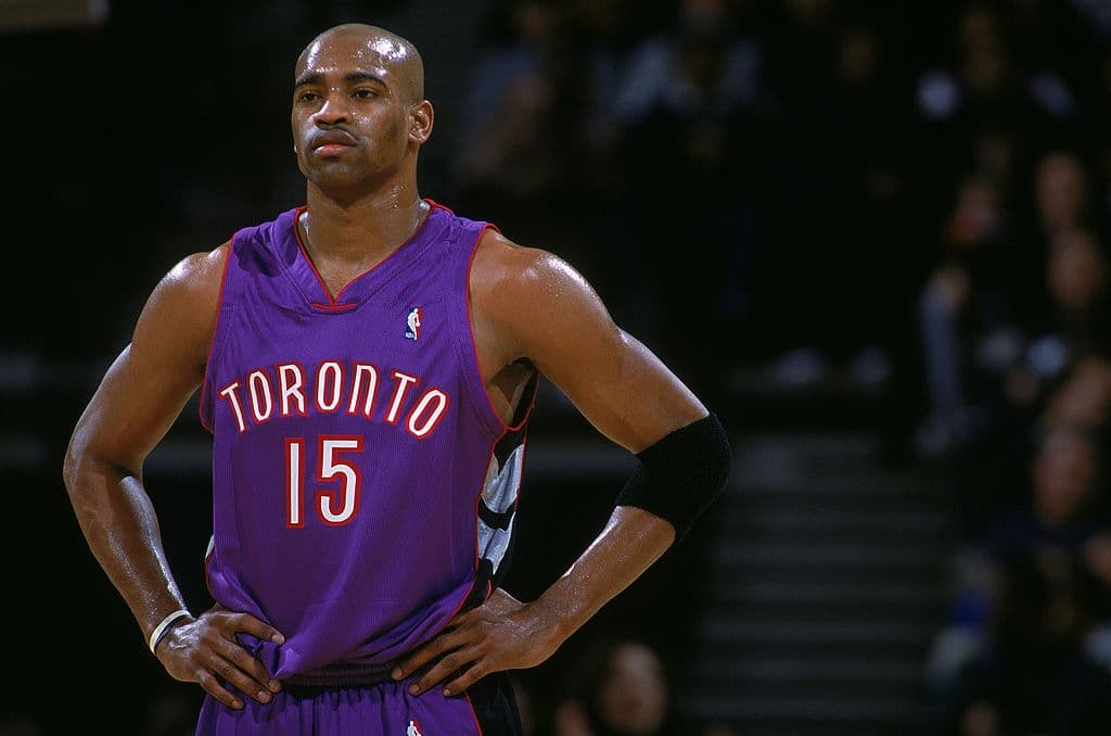 8 Dec 2000: Vince Carter #15 of the Toronto Raptors looks on from the court during the game against the Golden State Warriors at The Arena in Oakland, California. The Raptors defeated the Warriors 108-98. NOTE TO USER: It is expressly understood that the only rights Allsport are offering to license in this Photograph are one-time, non-exclusive editorial rights. No advertising or commercial uses of any kind may be made of Allsport photos. User acknowledges that it is aware that Allsport is an editorial sports agency and that NO RELEASES OF ANY TYPE ARE OBTAINED from the subjects contained in the photographs.Mandatory Credit: Jed Jacobsohn /Allsport