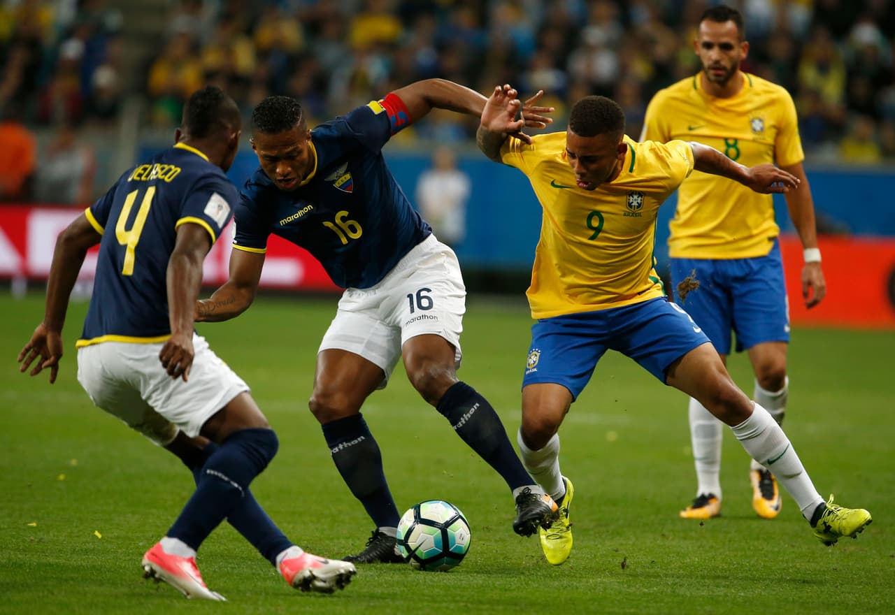 Ecuador's Antonio Valencia, center left, fight for the ball with Brazil's Gabriel Jesus, center right, as Ecuador's Pedro Velasco, left, and Brazil's Renato Augusto, right, look on during a World Cup qualifying soccer match in Porto Alegre, Brazil, Thursday, Aug. 31 2017. (AP Photo/Leo Correa)