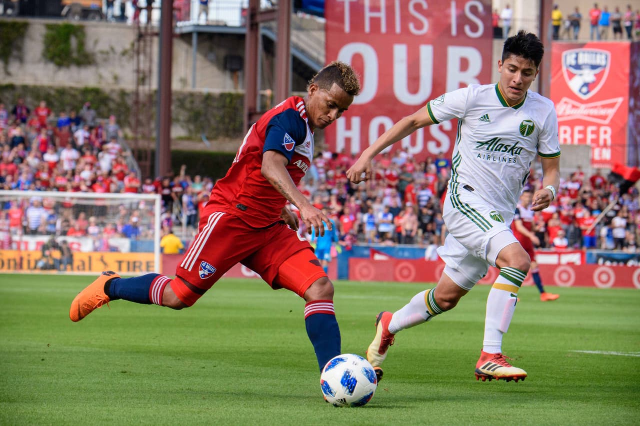 Mar 24, 2018; Frisco, TX, USA; FC Dallas midfielder Michael Barrios (21) and Portland Timbers defender Marco Farfan (32) in action during the game at Toyota Stadium. The game ends in a 1-1 draw. Mandatory Credit: Jerome Miron-USA TODAY Sports