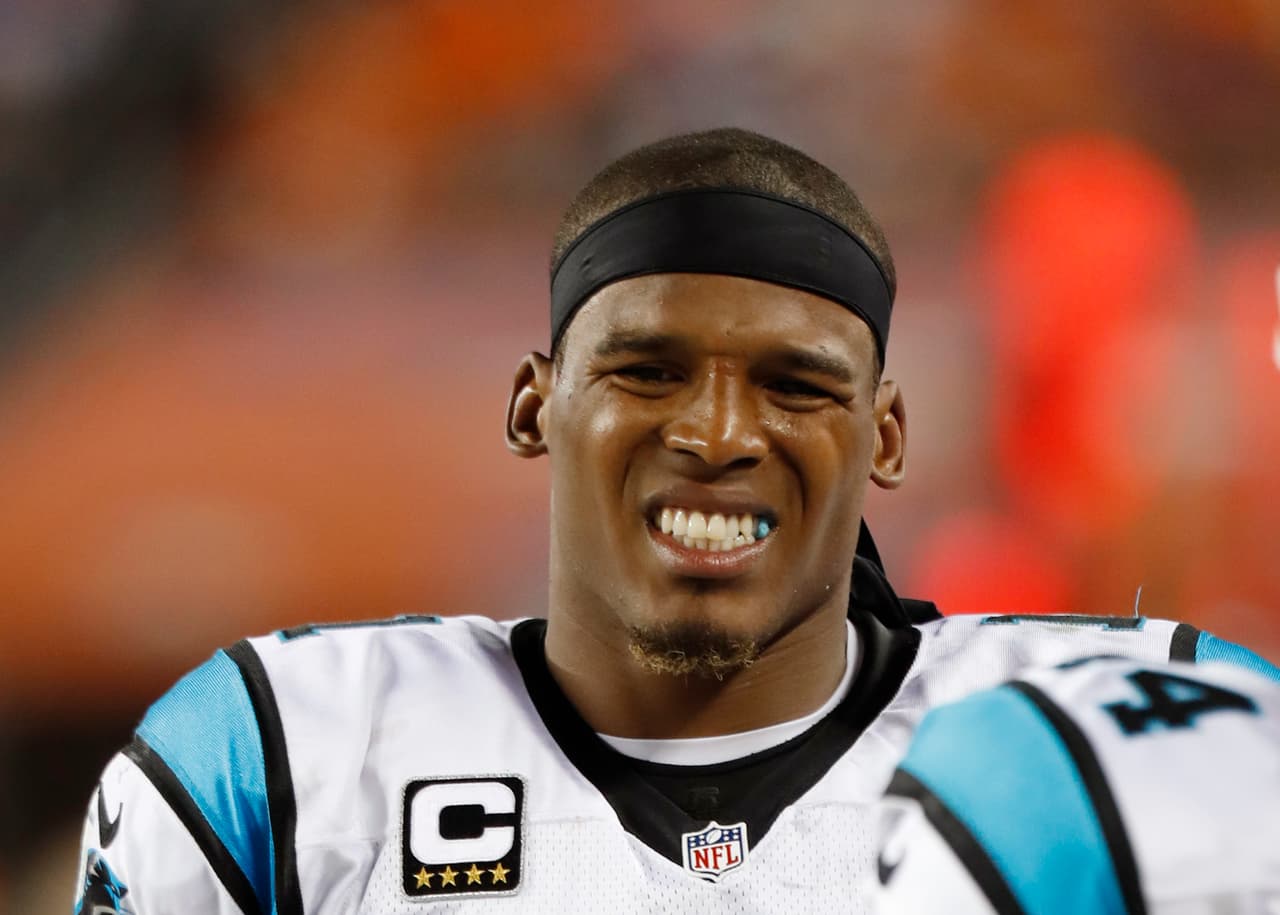 Carolina Panthers quarterback Cam Newton (1) grimaces in pain after taking a big hit during an NFL game against the Denver Broncos on Thursday, September 8, 2016. The Broncos defeated the Panthers 21-20. (Kevin Terrell via AP)