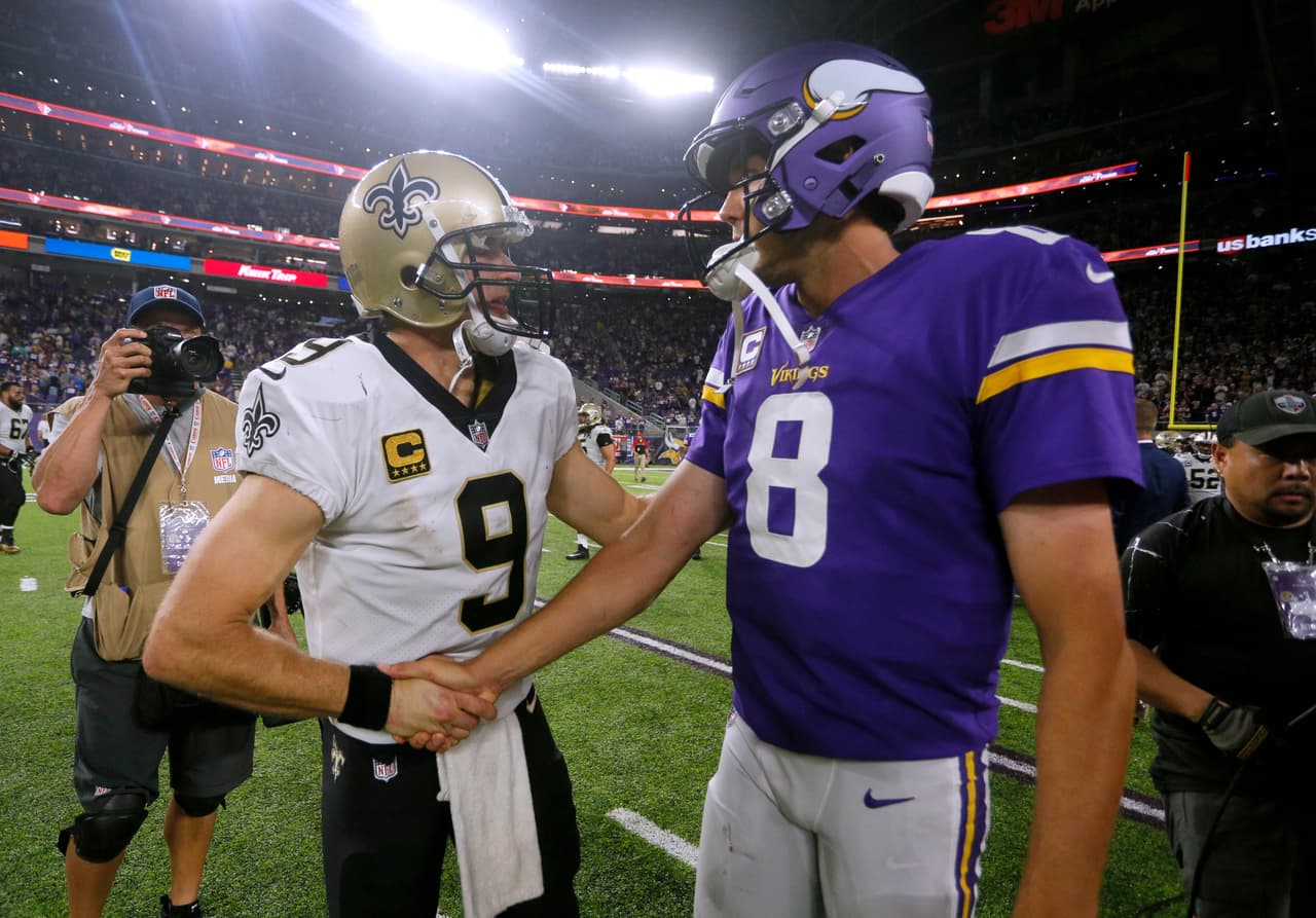 New Orleans Saints quarterback Drew Brees, left, talks with Minnesota Vikings quarterback Sam Bradford after an NFL football game, Monday, Sept. 11, 2017, in Minneapolis. The Vikings won 29-19. (AP Photo/Bruce Kluckhohn)