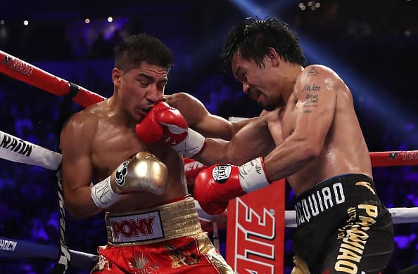 LAS VEGAS, NV - NOVEMBER 05: (R-L) Manny Pacquiao of the Philippines lands a right to the head of Jessie Vargas during their WBO welterweight championship fight at the Thomas & Mack Center on November 5, 2016 in Las Vegas, Nevada. (Photo by Christian Petersen/Getty Images)