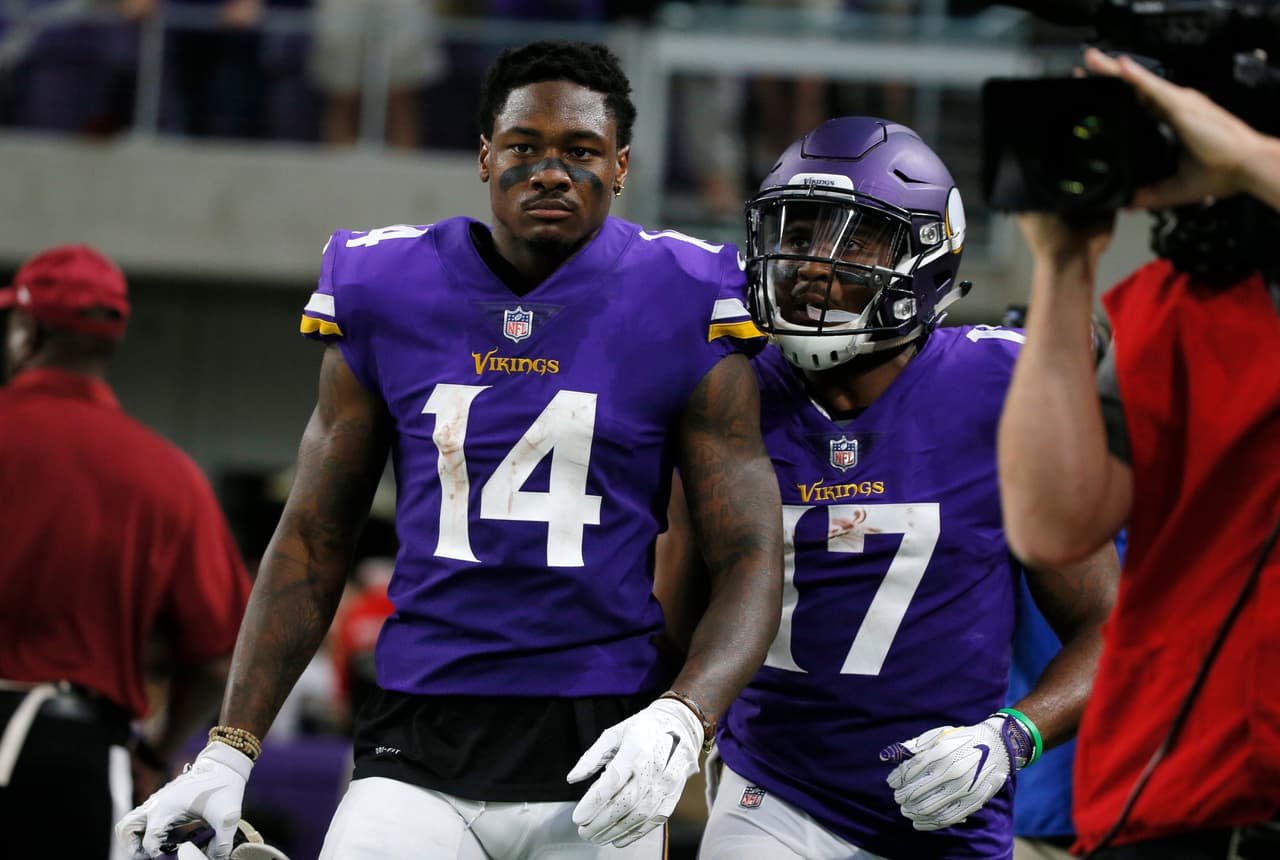 Minnesota Vikings wide receiver Stefon Diggs (14) celebrates with teammate Jarius Wright (17) after catching an 18-yard touchdown pass during the first half of an NFL football game against the New Orleans Saints, Monday, Sept. 11, 2017, in Minneapolis. (AP Photo/Bruce Kluckhohn)