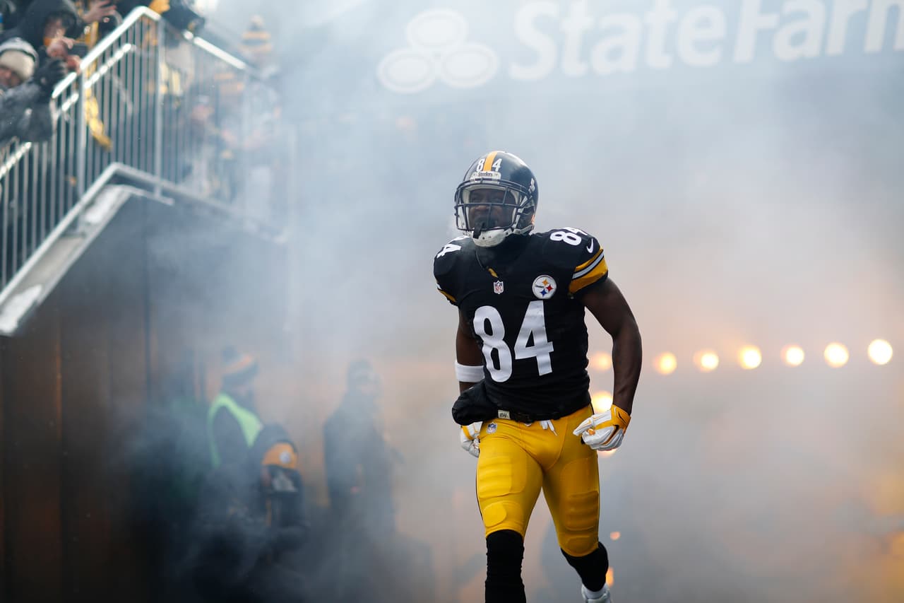 Pittsburgh Steelers wide receiver Antonio Brown (84) runs onto the field during player introductions prior to an NFL AFC wild card playoff football game against the Miami Dolphins on Sunday, Jan. 8, 2017, in Pittsburgh. Pittsburgh won 30-12. (Aaron M. Sprecher via AP)
