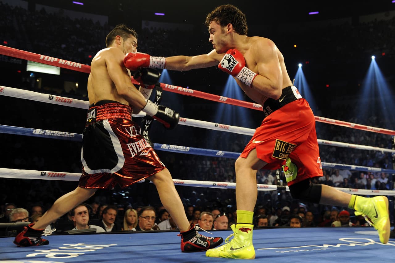 LAS VEGAS, NV - SEPTEMBER 15: Julio Cesar Chavez Jr. (R) exchanges punches with Sergio Martinez in the second round of their WBC middleweight title fight at the Thomas & Mack Center on September 15, 2012 in Las Vegas, Nevada. (Photo by Jeff Bottari/Getty Images)