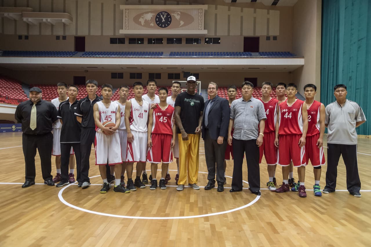 Former NBA star Dennis Rodman (C) of the US poses with North Korean basketball players at the Pyongyang Indoor Stadium on June 15, 2017 Rodman arrived in the North Korean capital on June 13 on a mission he said he believed the US President would be "pretty happy" about, adding he was trying to accomplish something that "we both need". / AFP PHOTO / KIM Won-Jin (Photo credit should read KIM WON-JIN/AFP/Getty Images)