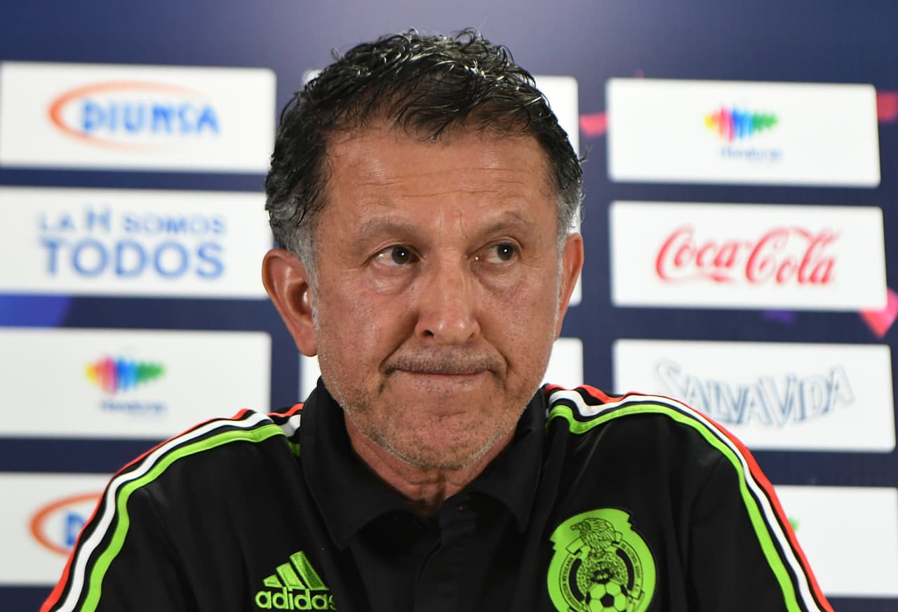 Juan Carlos Osorio (L), the coach of Mexico's national football team, gestures as he answers questions from the press in San Pedro Sula, 180 km north of Tegucigalpa on October 9, 2017, one day ahead of their Russia World Cup 2018 eliminatory game against Honduras. / AFP PHOTO / ORLANDO SIERRA (Photo credit should read ORLANDO SIERRA/AFP/Getty Images)