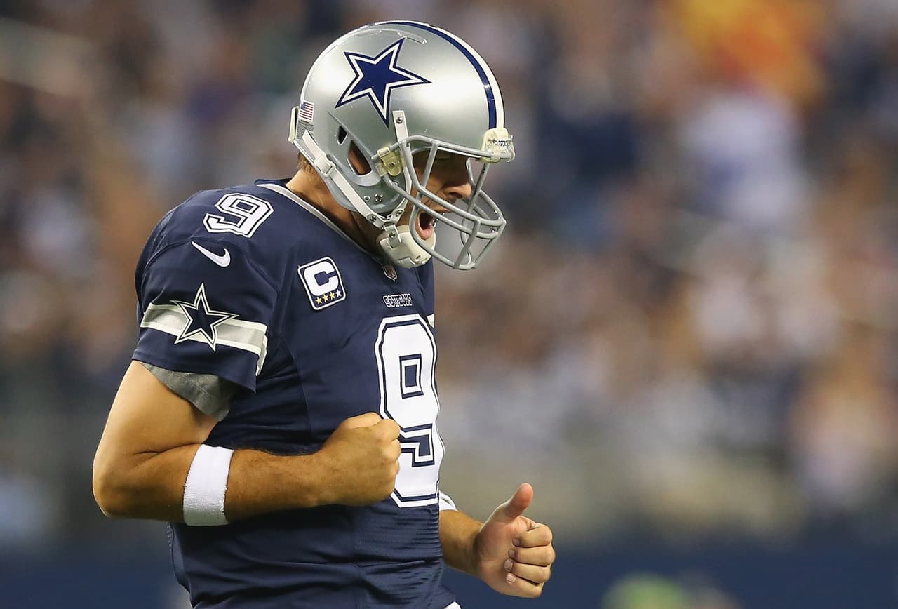 ARLINGTON, TX - NOVEMBER 28: Tony Romo #9 of the Dallas Cowboys celebrates a touchdown against the Oakland Raiders at AT&T Stadium on November 28, 2013 in Arlington, Texas. (Photo by Ronald Martinez/Getty Images)