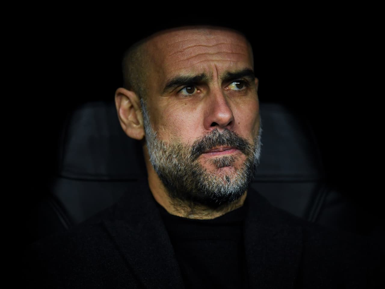 MADRID, SPAIN - FEBRUARY 26: Josep Guardiola, manager of Manchester City FC looks on during the UEFA Champions League round of 16 first leg match between Real Madrid and Manchester City at Bernabeu on February 26, 2020 in Madrid, Spain. (Photo by David Ramos/Getty Images)