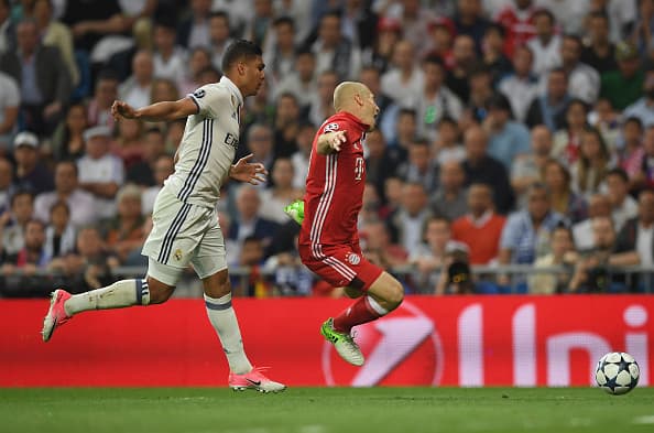 MADRID, SPAIN - APRIL 18: Arjen Robben of Bayern Muenchen is fouled by Casemiro of Real Madrid and a penalty is awarded during the UEFA Champions League Quarter Final second leg match between Real Madrid CF and FC Bayern Muenchen at Estadio Santiago Bernabeu on April 18, 2017 in Madrid, Spain. (Photo by Matthias Hangst/Bongarts/Getty Images)