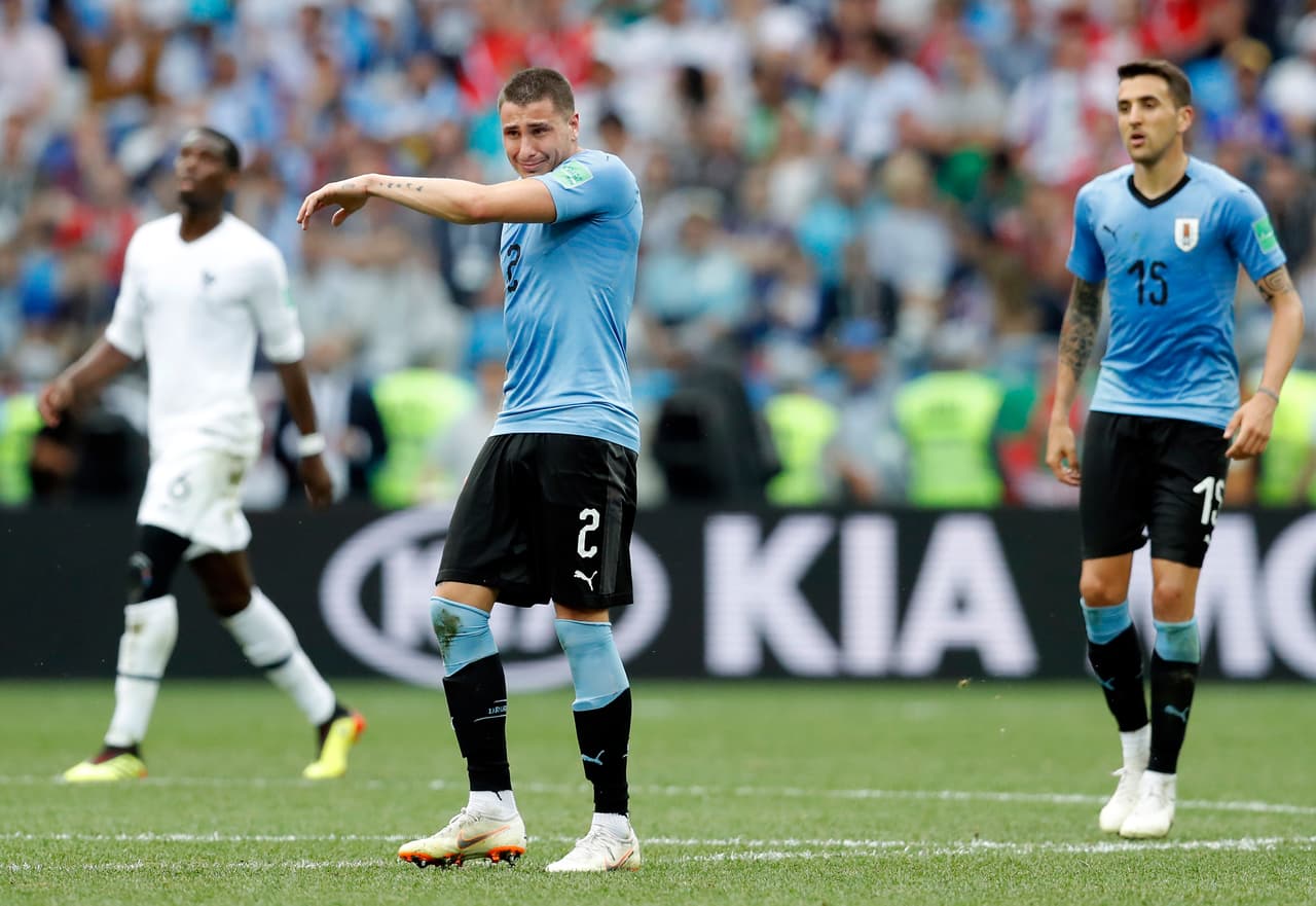 Uruguay's Jose Gimenez, center, reacts during the quarterfinal match between Uruguay and France at the 2018 soccer World Cup in the Nizhny Novgorod Stadium, in Nizhny Novgorod, Russia, Friday, July 6, 2018. (AP Photo/David Vincent)
