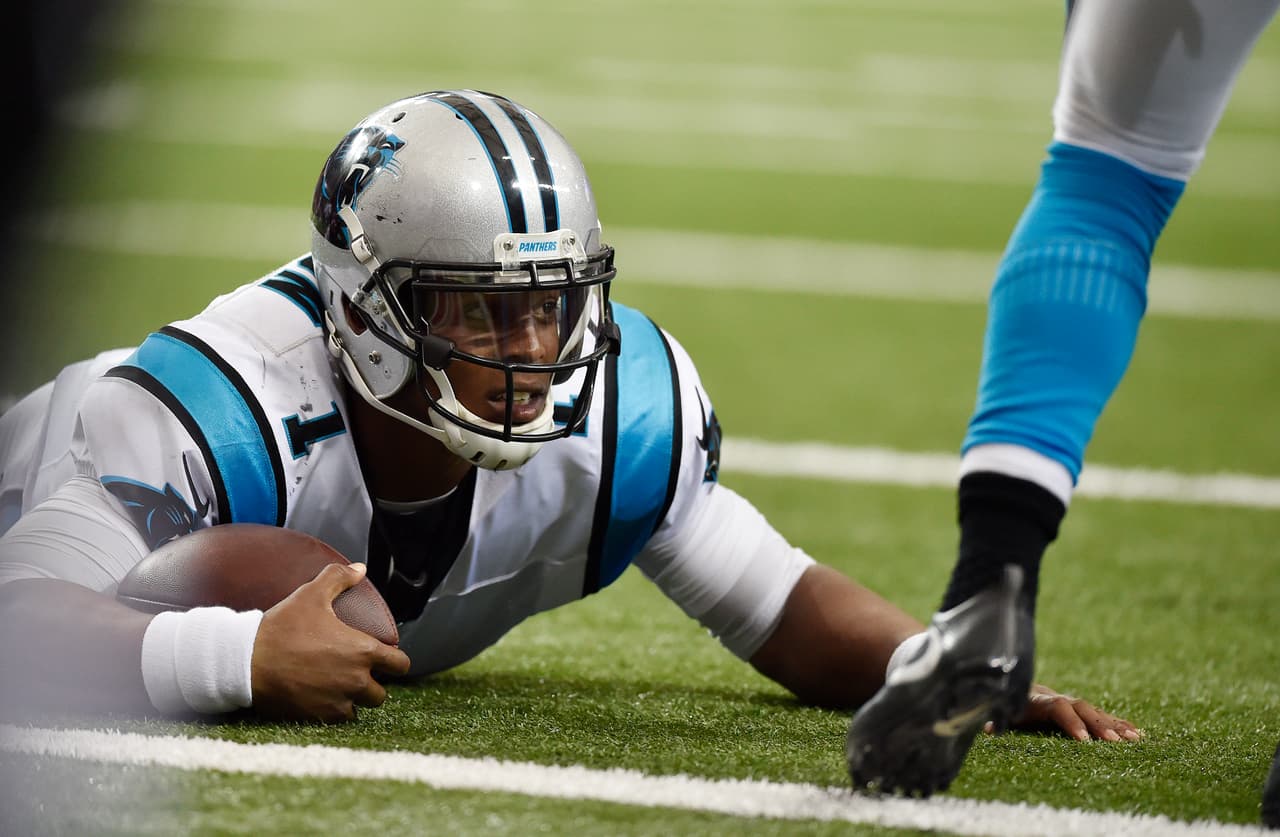 Carolina Panthers quarterback Cam Newton (1) lies on the turf after being hit against the Atlanta Falcons during the second half of an NFL football game, Sunday, Oct. 2, 2016, in Atlanta. (AP Photo/Rainier Ehrhardt)