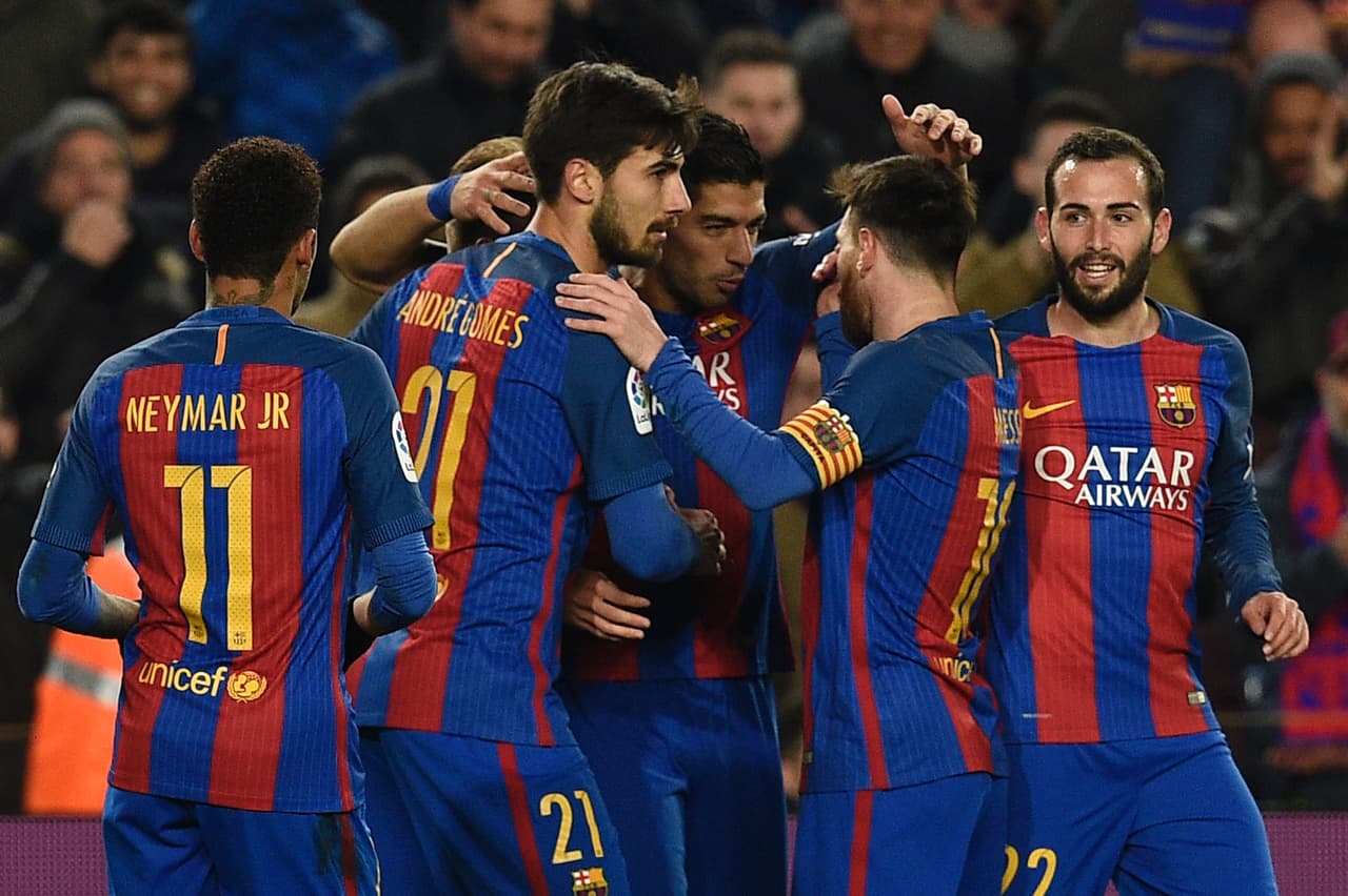 Barcelona's Uruguayan forward Luis Suarez (C) celebrates with teammates after scoring during the Spanish Copa del Rey (King's Cup) quarter final second leg football match FC Barcelona vs Real Sociedad at the Camp Nou stadium in Barcelona on January 26, 2017. / AFP / LLUIS GENE (Photo credit should read LLUIS GENE/AFP/Getty Images)