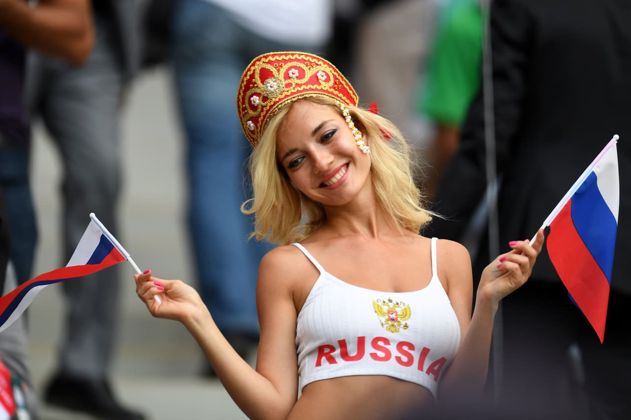 TOPSHOT - A Russia fan poses before the start of the Russia 2018 World Cup Group A football match between Russia and Saudi Arabia at the Luzhniki Stadium in Moscow on June 14, 2018. (Photo by Patrik STOLLARZ / AFP) / RESTRICTED TO EDITORIAL USE - NO MOBILE PUSH ALERTS/DOWNLOADS (Photo credit should read PATRIK STOLLARZ/AFP/Getty Images)