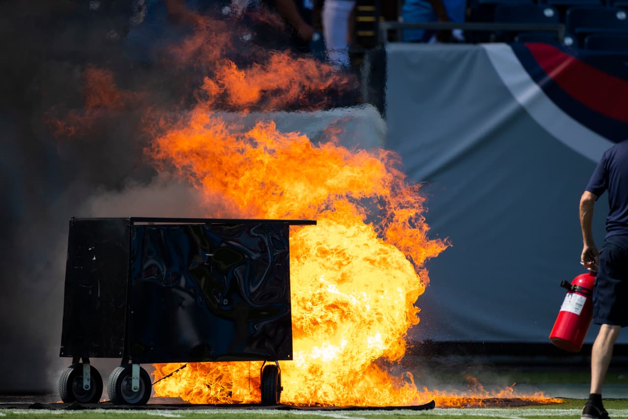 NASHVILLE, TN - SEPTEMBER 15: A failed pyrotechnic device bursts into flames before the game between the Tennessee Titans and the Indianapolis Colts at Nissan Stadium on September 15, 2019 in Nashville, Tennessee. (Photo by Brett Carlsen/Getty Images)