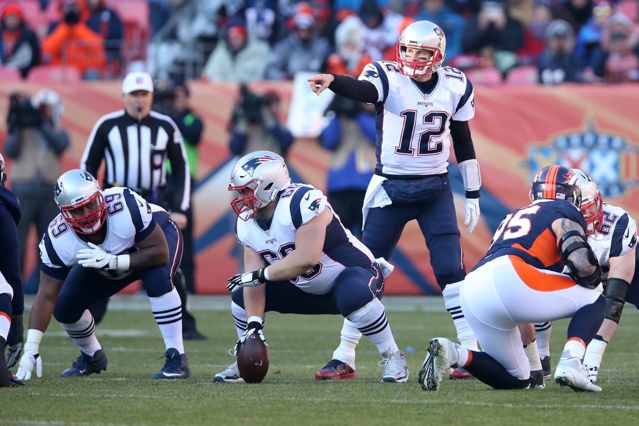 DENVER, CO - DECEMBER 18: Tom Brady #12 of the New England Patriots calls a play during the game against the Denver Broncos at Sports Authority Field At Mile High on December 18, 2016 in Denver, Colorado. The Patriots defeated the Broncos 16-3. (Photo by Rob Leiter/Getty Images)