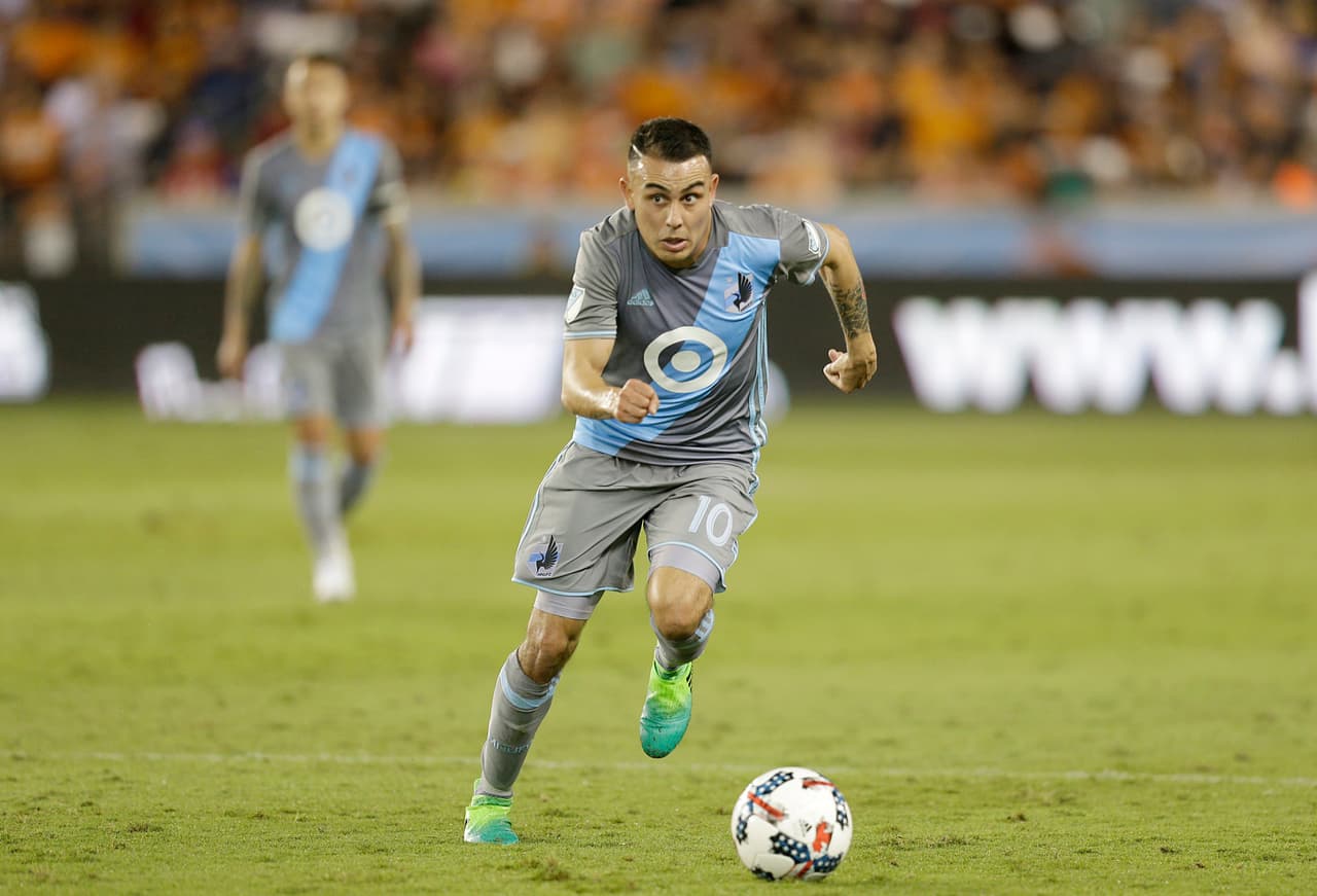 Apr 15, 2017; Houston, TX, USA; Minnesota United midfielder Miguel Ibarra (10) dribbles against the Houston Dynamo in the second half at BBVA Compass Stadium.Dynamo tied the United 2 to 2. Mandatory Credit: Thomas B. Shea-USA TODAY Sports