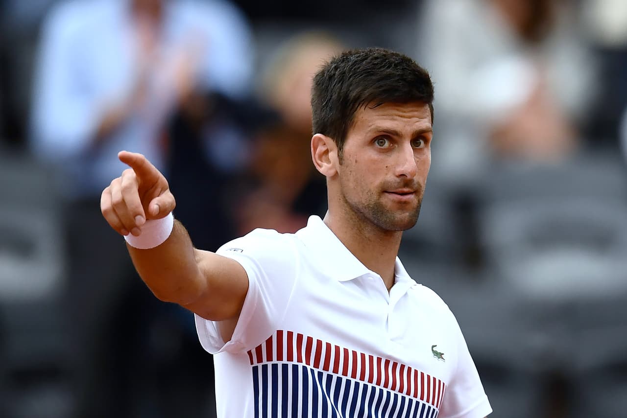 Serbia's Novak Djokovic celebrates after a point against Argentina's Diego Schwartzman during their tennis match at the Roland Garros 2017 French Open on June 2, 2017 in Paris. / AFP PHOTO / CHRISTOPHE SIMON (Photo credit should read CHRISTOPHE SIMON/AFP/Getty Images)