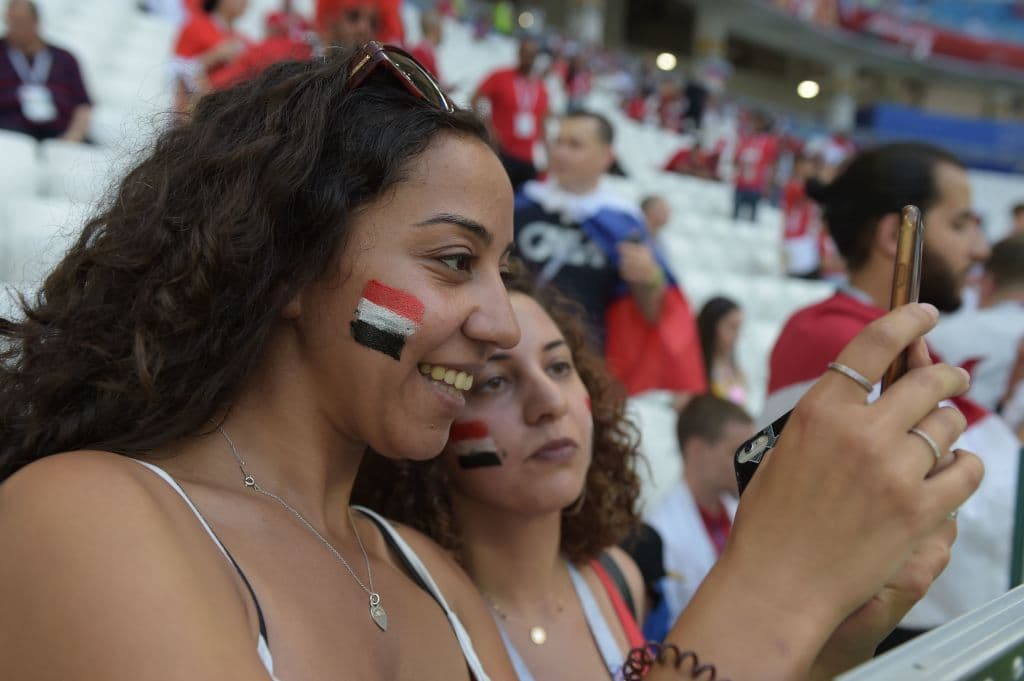 An Egypt fan takes a photo before the Russia 2018 World Cup Group A football match between Saudi Arabia and Egypt at the Volgograd Arena in Volgograd on June 25, 2018. (Photo by Nicolas ASFOURI / AFP) / RESTRICTED TO EDITORIAL USE - NO MOBILE PUSH ALERTS/DOWNLOADS (Photo credit should read NICOLAS ASFOURI/AFP/Getty Images)