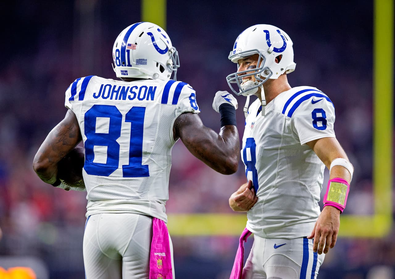 Indianapolis Colts quarterback matt Hasselbeck (8) and wide receiver Andre Johnson (81) celebrate a score during an NFL game against the Houston Texans on Thursday, Oct. 8, 2015, in Houston, Texas. The Colts won the game, 27-20. (Greg Trott via AP)
