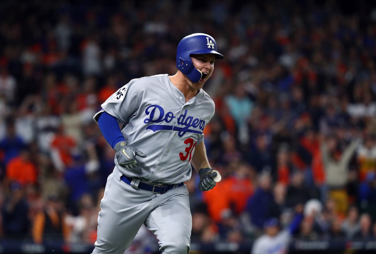 HOUSTON, TX - OCTOBER 28: Joc Pederson #31 of the Los Angeles Dodgers reacts after hitting a three-run home run in the ninth inning of Game 4 of the 2017 World Series against the Houston Astros at Minute Maid Park on Saturday, October 28, 2017 in Houston, Texas. (Photo by Alex Trautwig/MLB Photos via Getty Images)