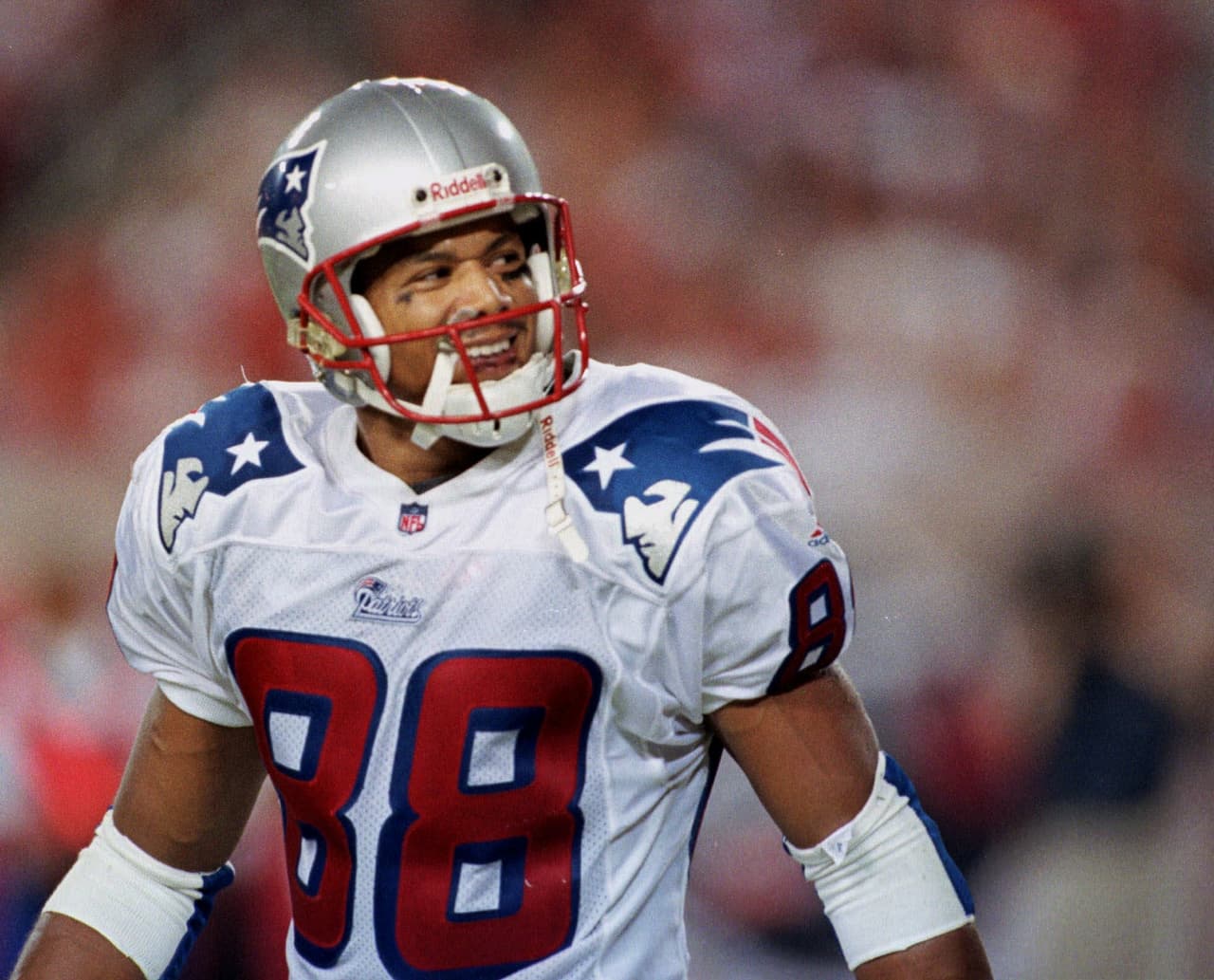 New England Patriots wide receiver Terry Glenn looks back at hecklers behind the end zone after catching a touchdown pass from quarterback Drew Bledsoe during the second quarter against the Tampa Bay Buccaneers on Saturday night, Aug. 28, 1999, at Raymond James Stadium in Tampa, Fla. (AP Photo/Chris O'Meara)