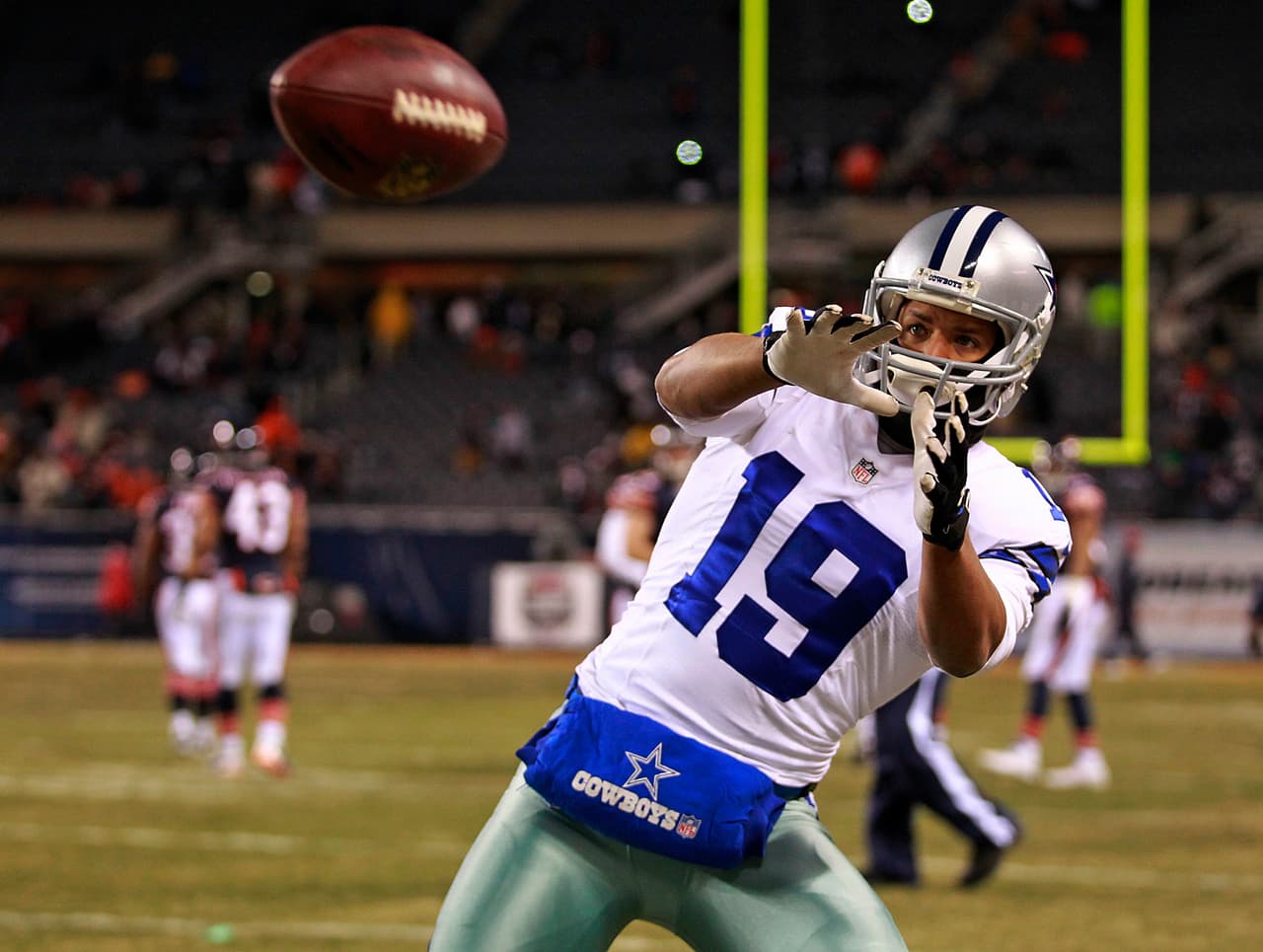 Dallas Cowboys receiver Miles Austin (19) catches a pass before an NFL football game against the Chicago Bears on Monday, December 9, 2013 at Soldier Field in Chicago, Illinois. The Bears defeated the Cowboys, 45-28. (AP Photo/James D. Smith)