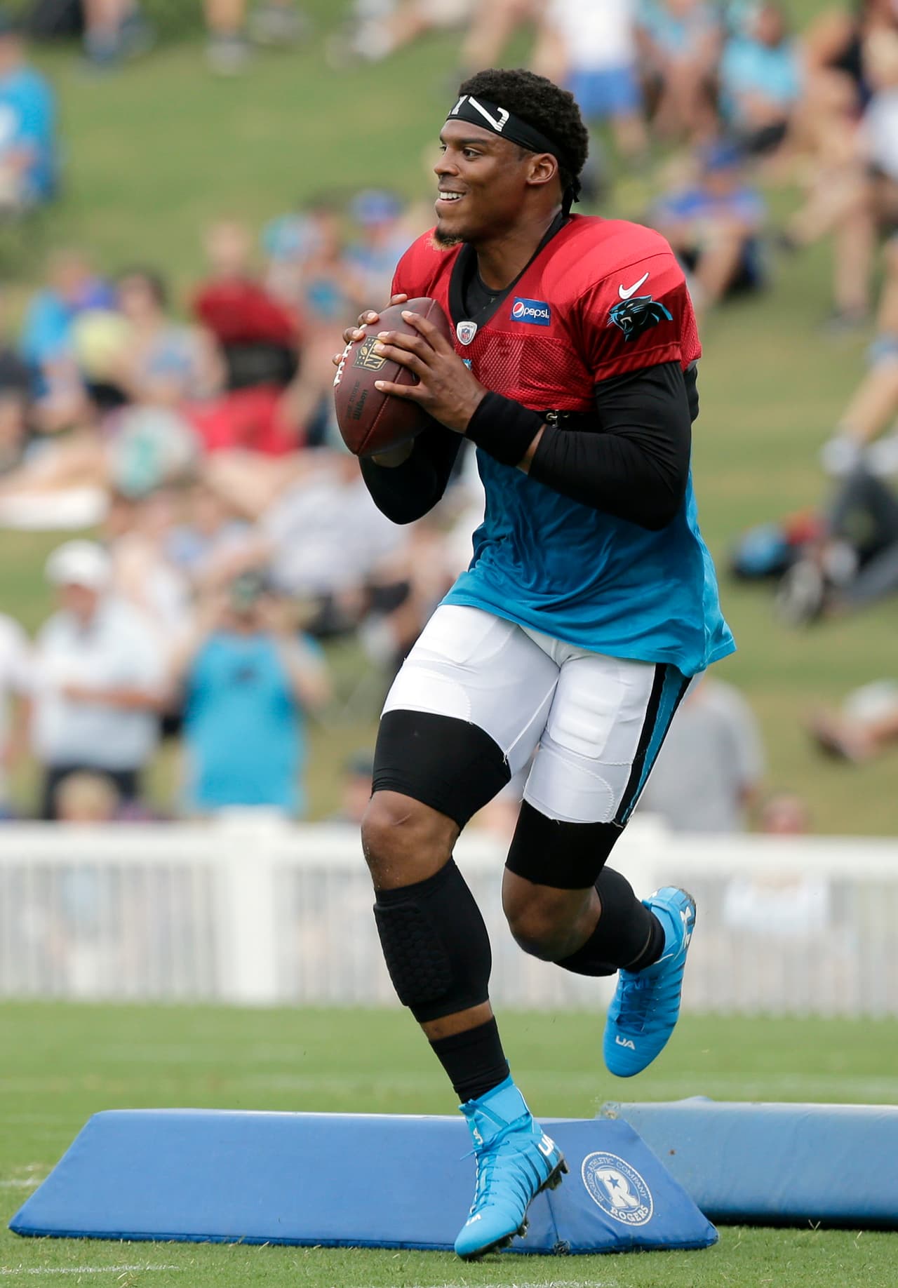 Carolina Panthers' Cam Newton (1) runs a drill during practice at the NFL team's football training camp at Wofford College in Spartanburg, S.C., Friday, July 28, 2017. (AP Photo/Chuck Burton)
