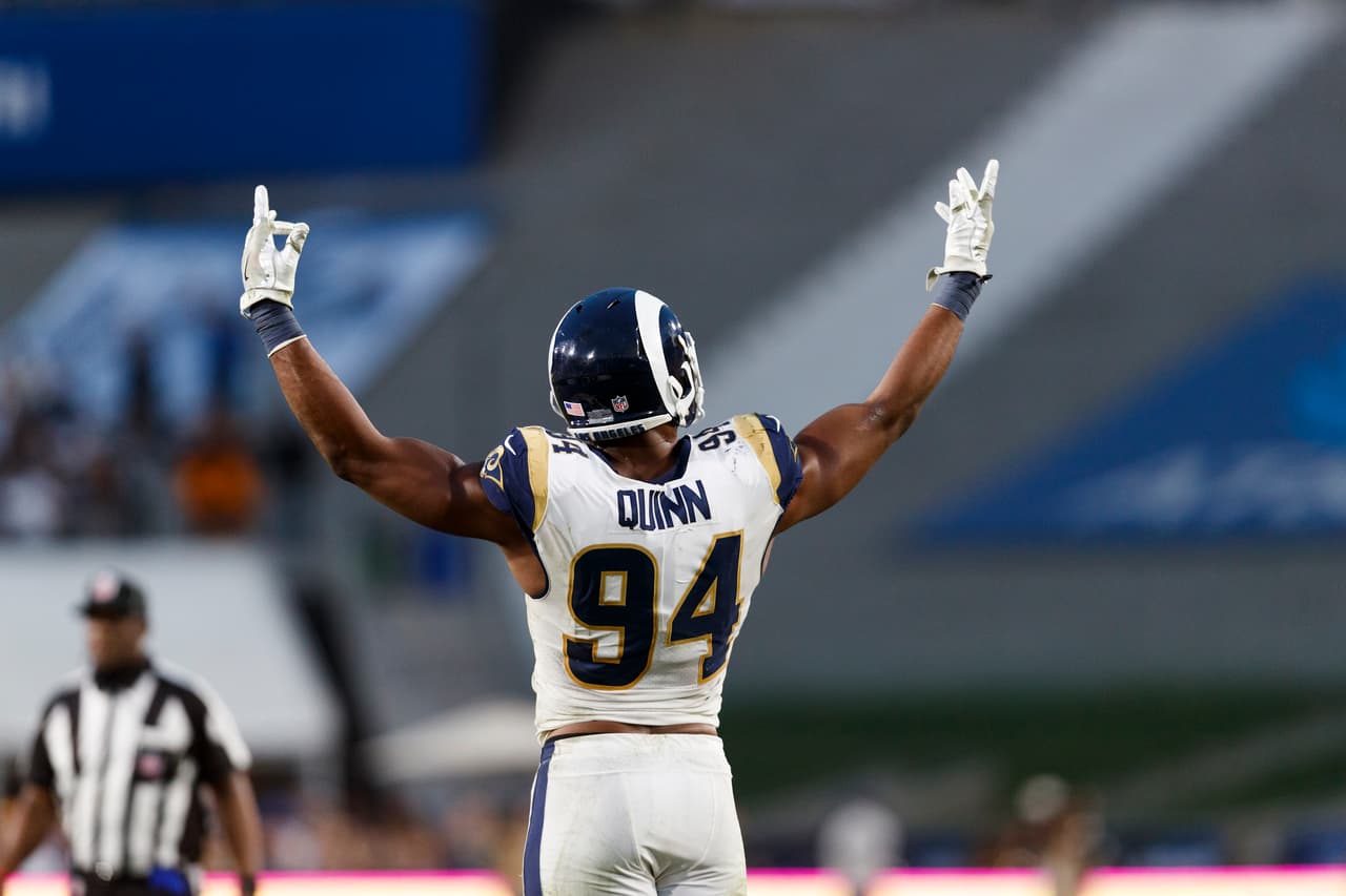 Los Angeles Rams outside linebacker Robert Quinn (94) raises his arms during an NFL football game against the Philadelphia Eagles, Sunday, Dec. 10, 2017, in Los Angeles. The Eagles defeated the Rams, 43-35. (Ryan Kang via AP)