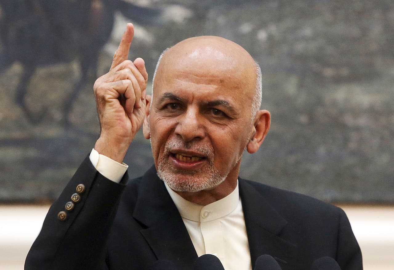 FILE - In this July 15, 2018, file photo, Afghan President Ashraf Ghani speaks during a press conference at the presidential palace in Kabul, Afghanistan. Ghani on Tuesday, Dec. 4, 2018, ordered an investigation after the Guardian reported that members of the national women's soccer team were sexually and physically abused by men from the country's football federation. (AP Photo/Rahmat Gul, File)