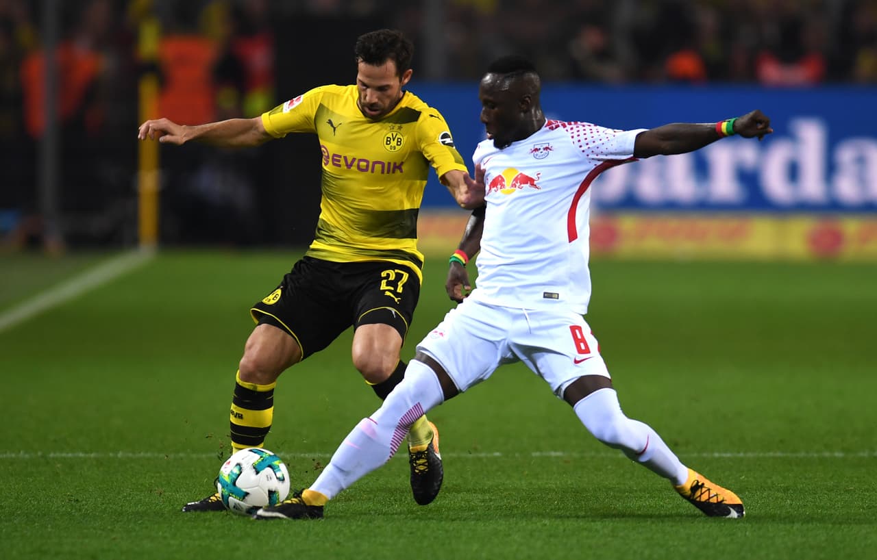 Leipzig's Guinean midfielder Naby Keita and Dortmund's midfielder Gonzalo Castro vie for the ball during the German first division Bundesliga football match Borussia Dortmund vs RB Leipzig in Dortmund, western Germany, on October 14, 2017. / AFP PHOTO / PATRIK STOLLARZ / RESTRICTIONS: DURING MATCH TIME: DFL RULES TO LIMIT THE ONLINE USAGE TO 15 PICTURES PER MATCH AND FORBID IMAGE SEQUENCES TO SIMULATE VIDEO. == RESTRICTED TO EDITORIAL USE == FOR FURTHER QUERIES PLEASE CONTACT DFL DIRECTLY AT + 49 69 650050 (Photo credit should read PATRIK STOLLARZ/AFP/Getty Images)