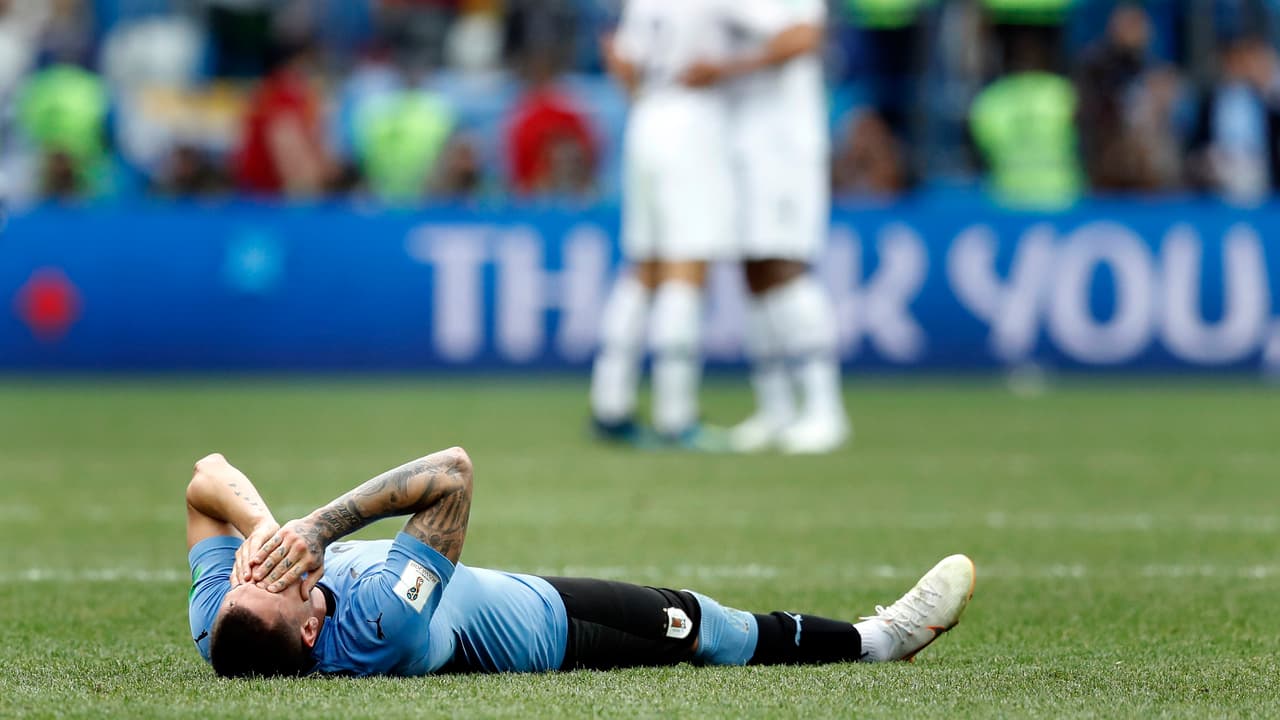 Uruguay's Jose Gimenez lies on the pitch after the quarterfinal match between Uruguay and France at the 2018 soccer World Cup in the Nizhny Novgorod Stadium, in Nizhny Novgorod, Russia, Friday, July 6, 2018. France defeated Uruguay by 2-0. (AP Photo/David Vincent)