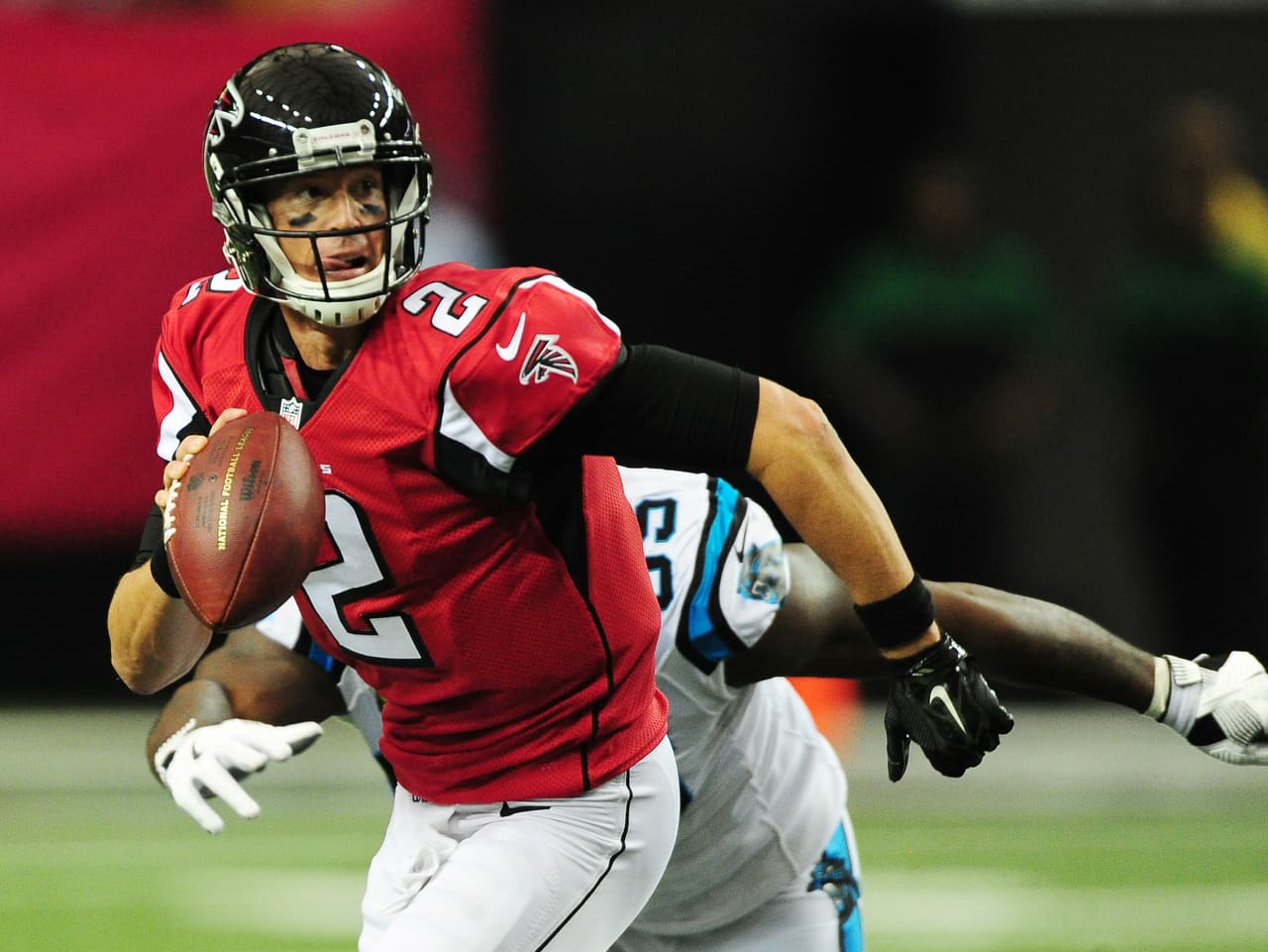 ATLANTA, GA - OCTOBER 2: Matt Ryan #2 of the Atlanta Falcons is pursued against Charles Johnson #95 of the Carolina Panthers at the Georgia Dome on October 2, 2016 in Atlanta, Georgia. (Photo by Scott Cunningham/Getty Images)