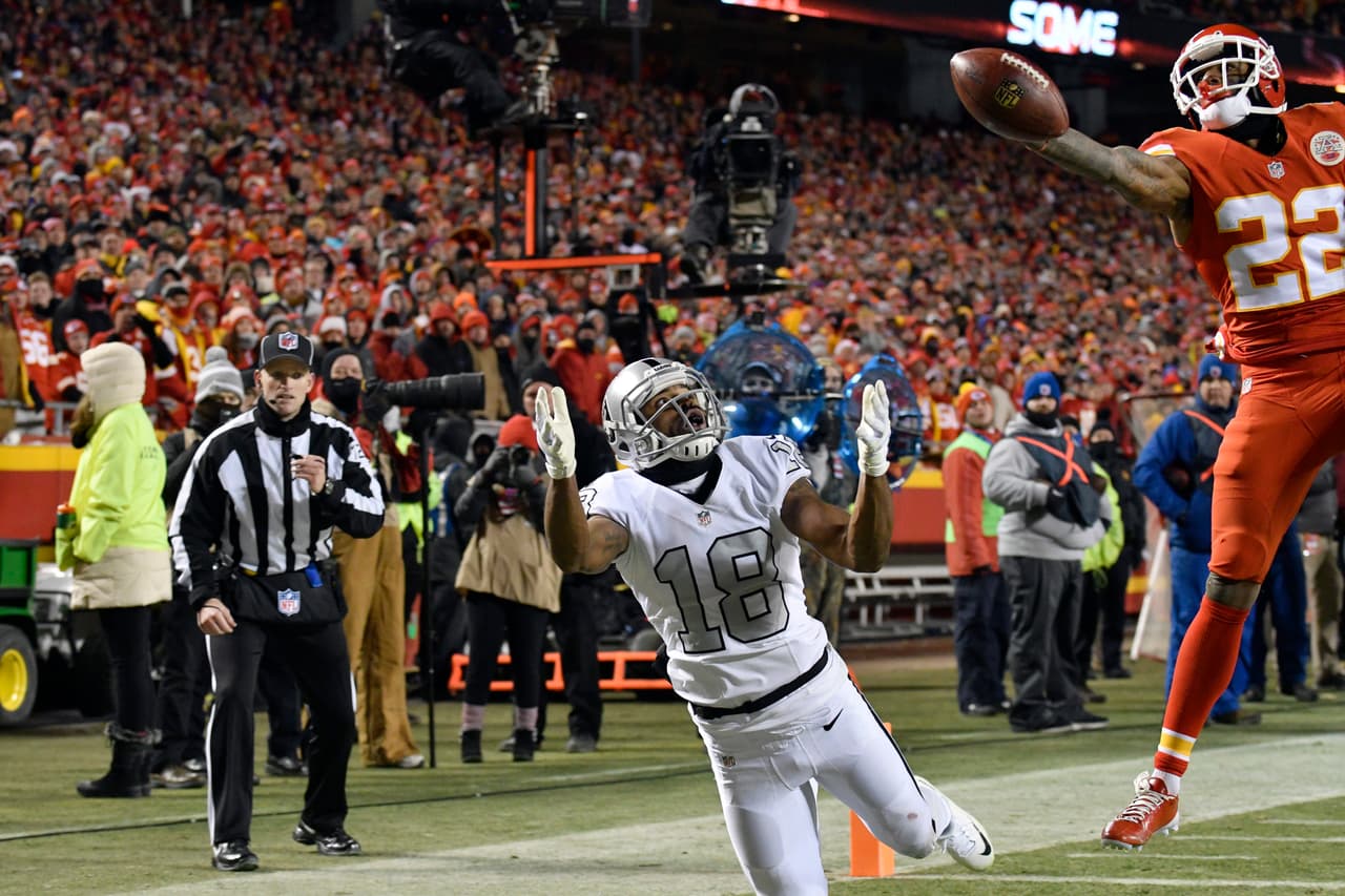 Kansas City Chiefs defensive back Marcus Peters (22) breaks up a pass intended for Oakland Raiders wide receiver Andre Holmes (18) in the end zone, during the second half of an NFL football game in Kansas City, Mo., Thursday, Dec. 8, 2016. (AP Photo/Ed Zurga)
