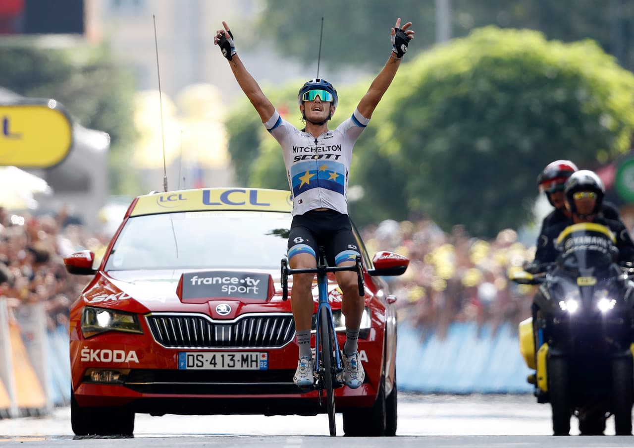 Italy's Matteo Trentin celebrates as he crosses the finish line to win the seventeenth stage of the Tour de France cycling race over 200 kilometers (124,27 miles) with start in Pont Du Gard and finish in Gap, France, Wednesday, July 24, 2019. (AP Photo/Christophe Ena)