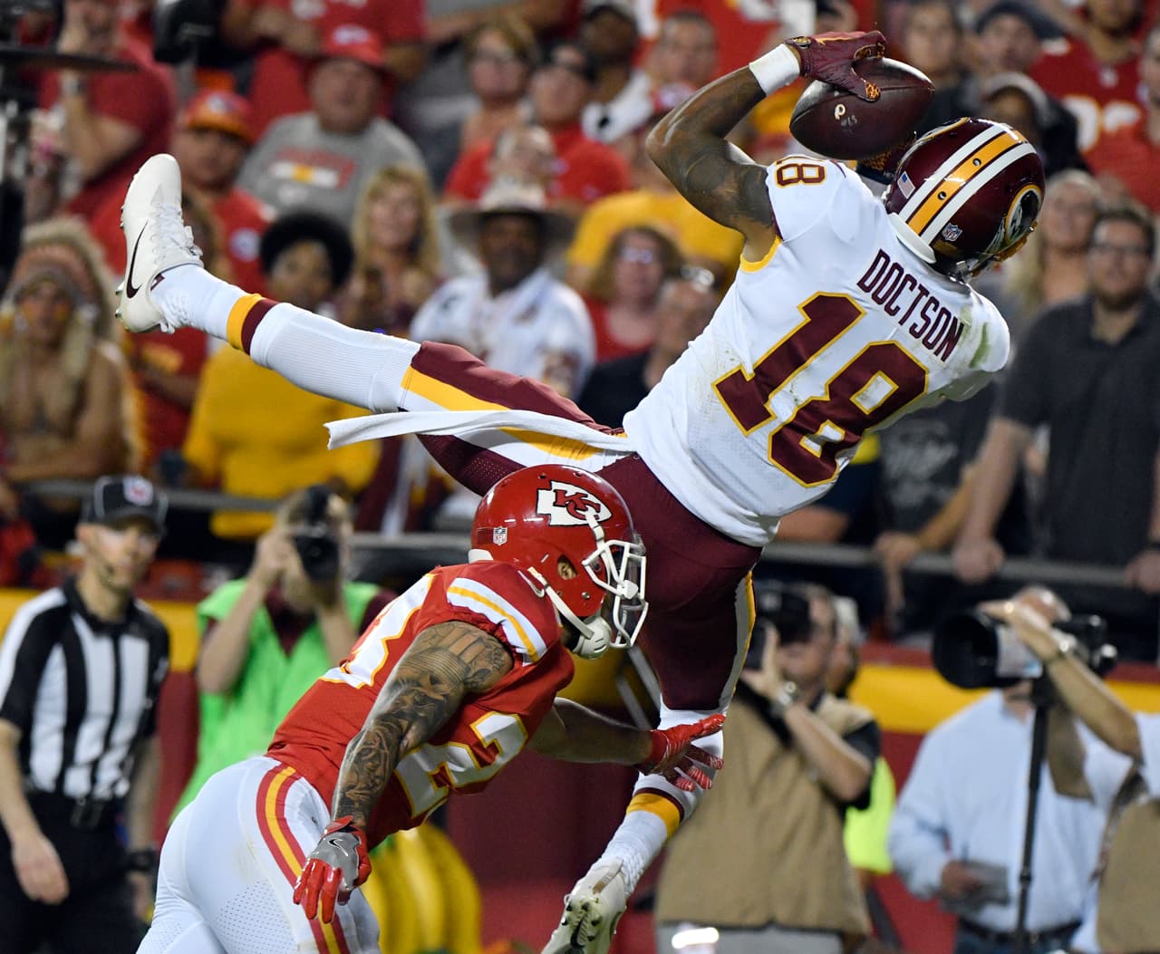 Washington Redskins wide receiver Josh Doctson (18) can't hold on to a pass in the end zone against Kansas City Chiefs defensive back Phillip Gaines (23) during the second half of an NFL football game in Kansas City, Mo., Monday, Oct. 2, 2017. The Chiefs won 29-20. (AP Photo/Ed Zurga)